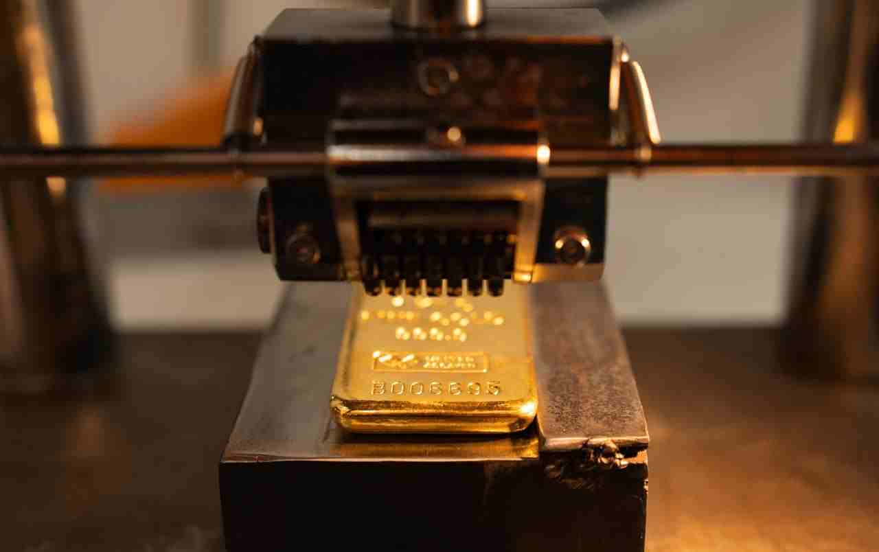 Molten metal being poured in assaying process