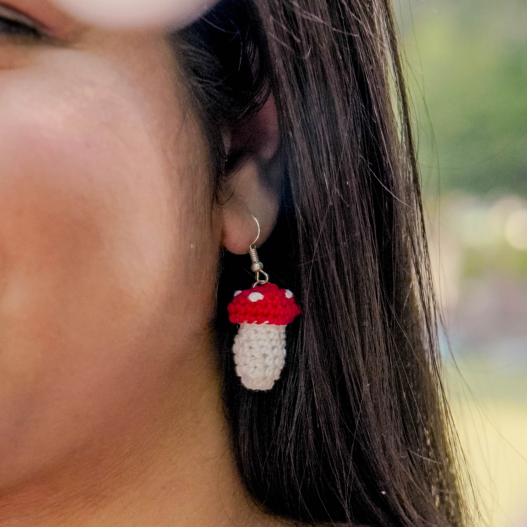 Model wearing the Mushroom Earrings by AHG. Perfect for nature lovers!