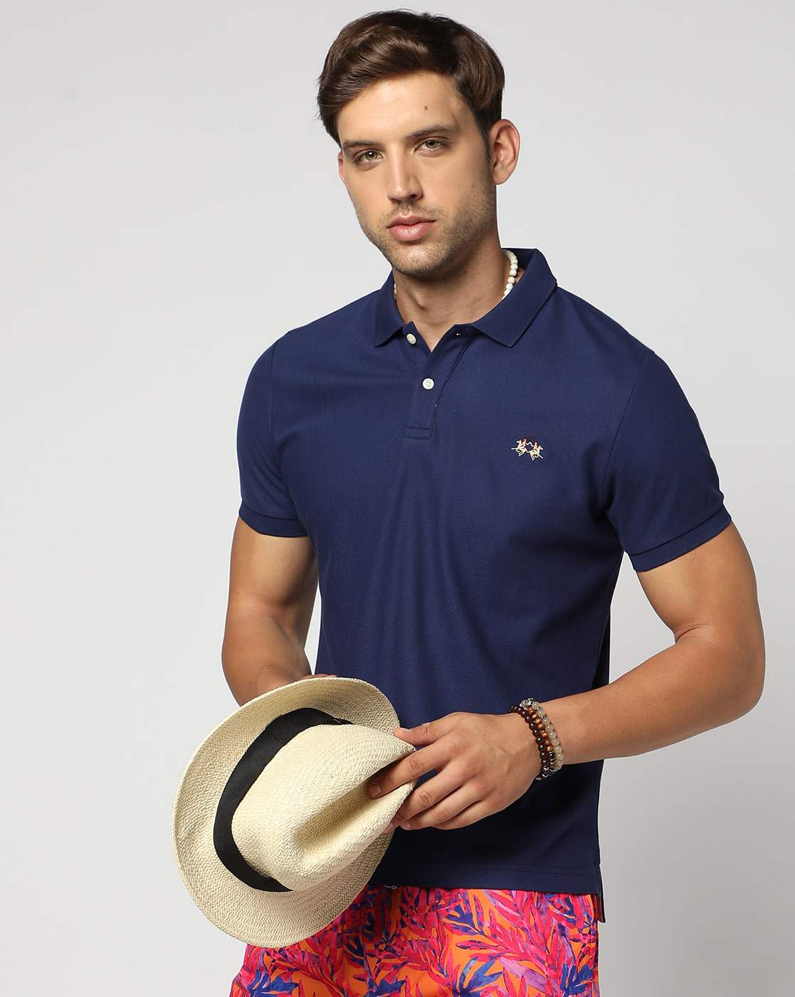 Cotton Slim Fit Solid Blue Polo with Multicolored Logo Embroidery