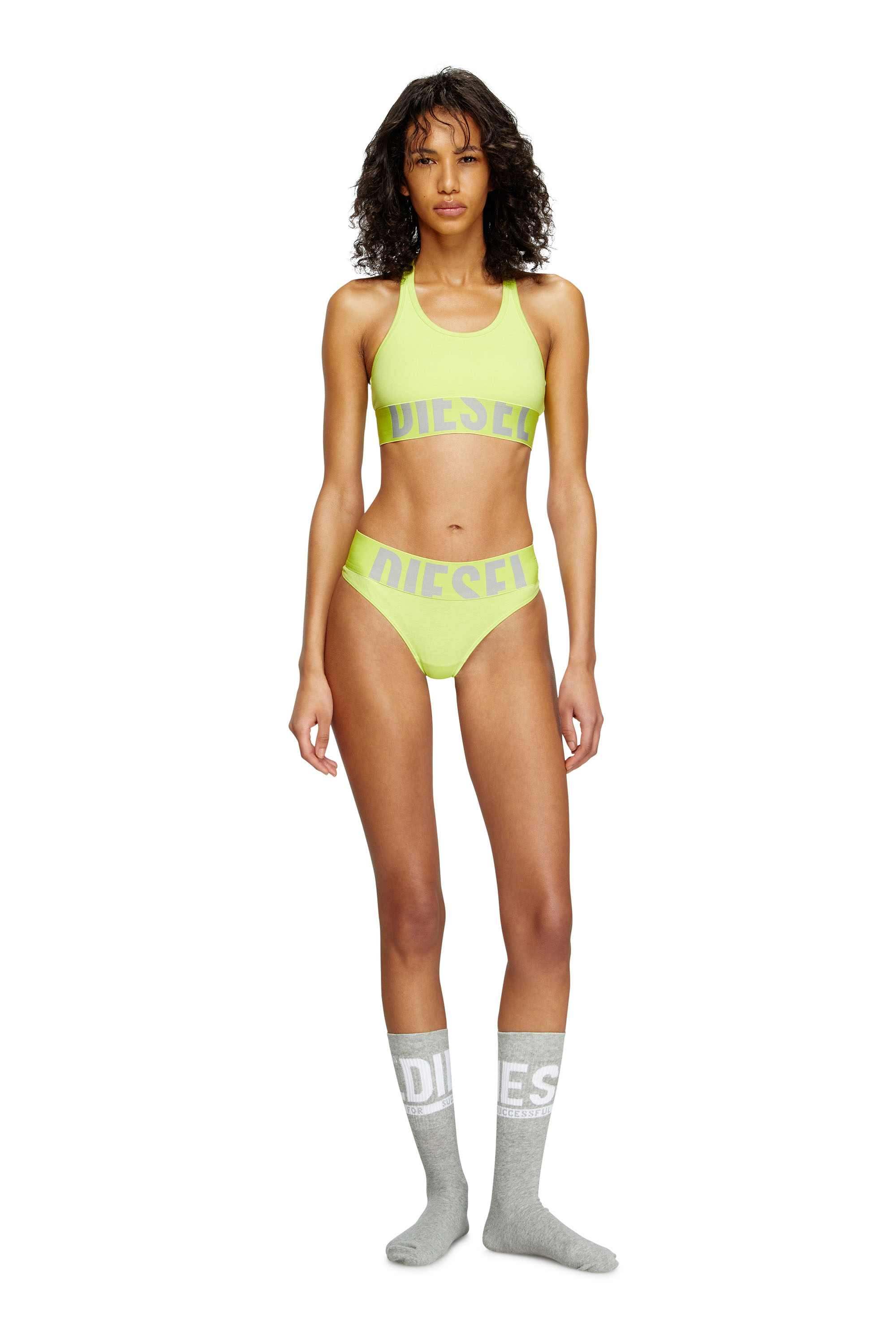 Green Sports bra with cut-off logo