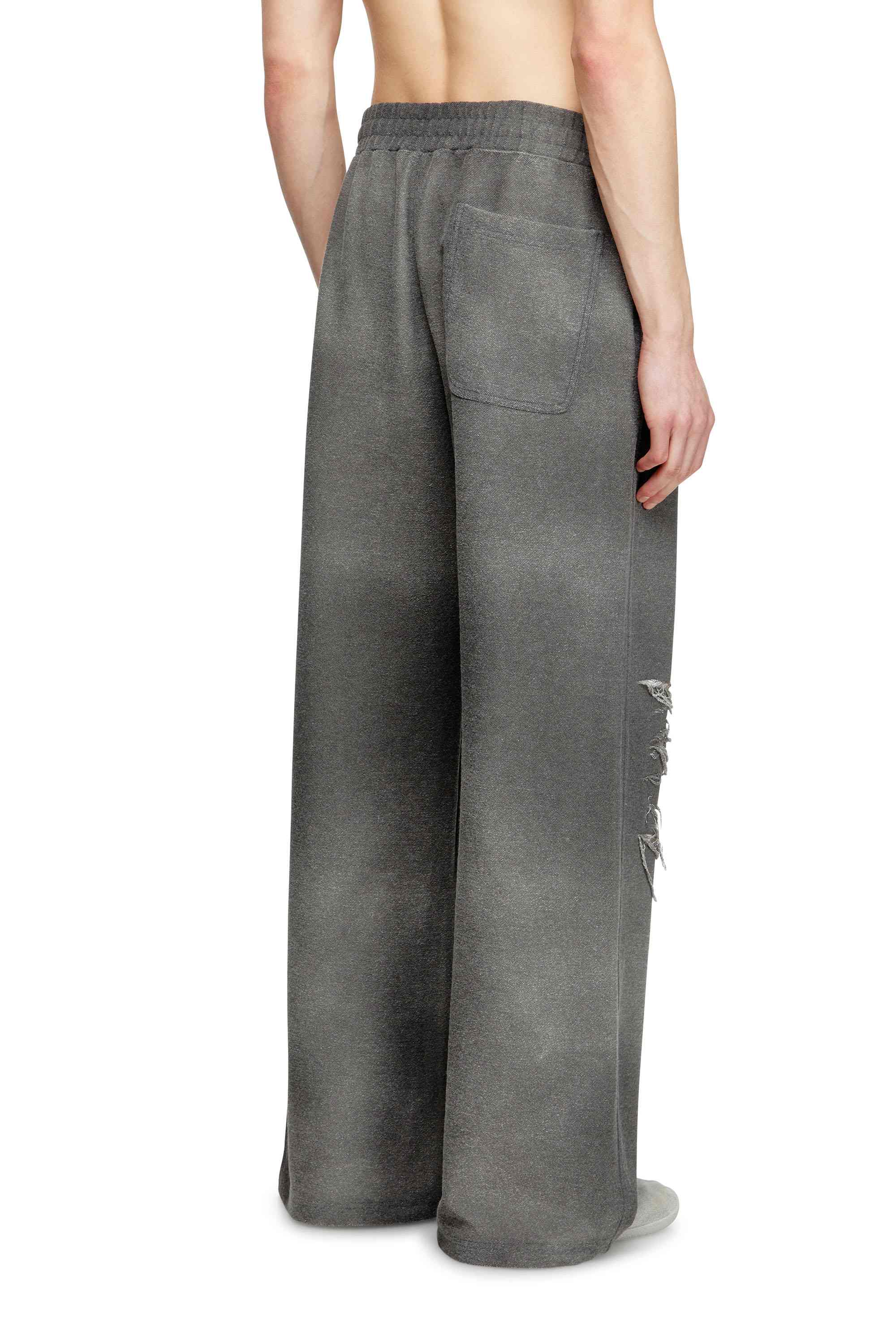 Grey Track pants with distressed front