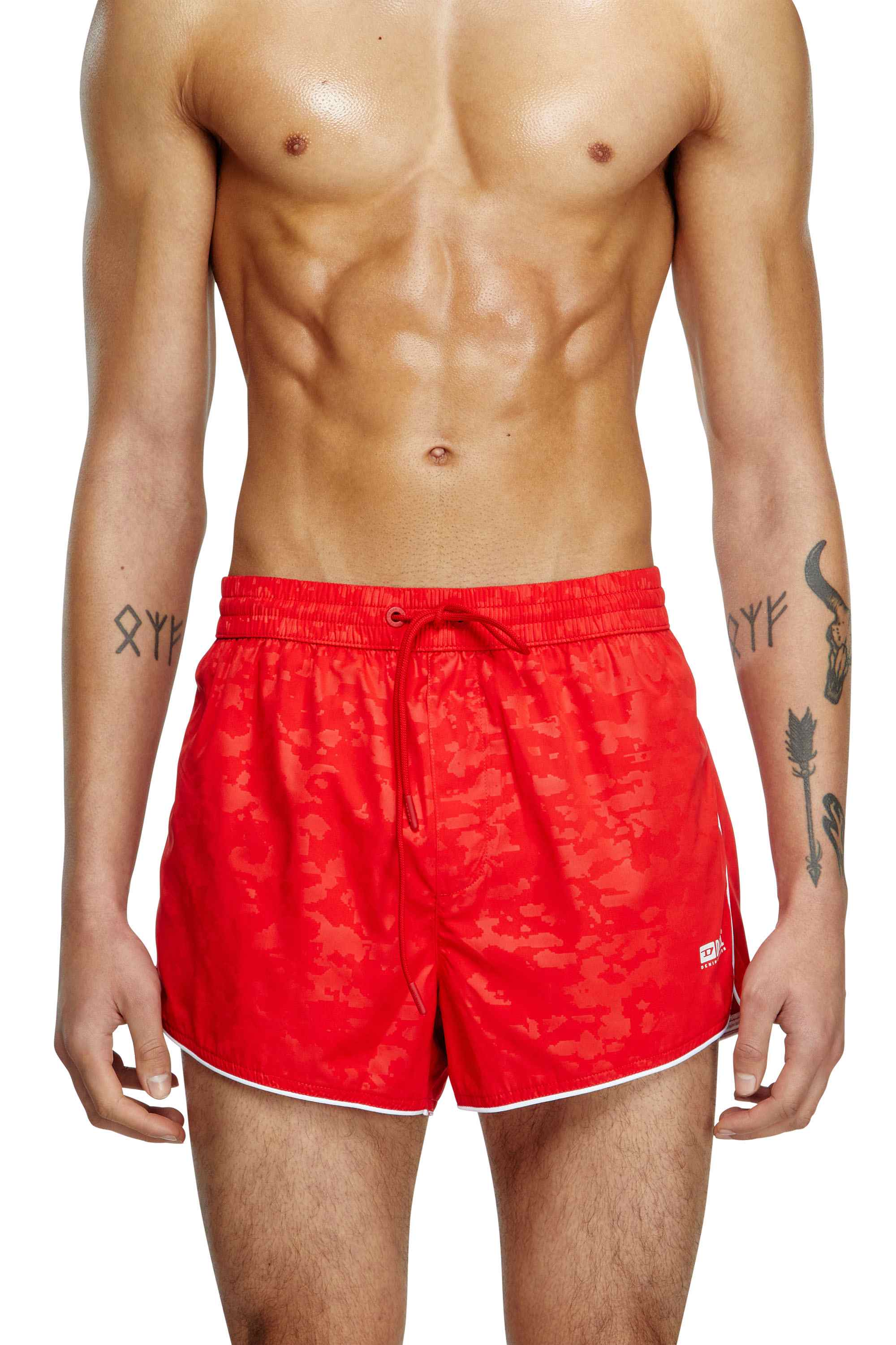 Red Swim shorts with pixelated camo motif