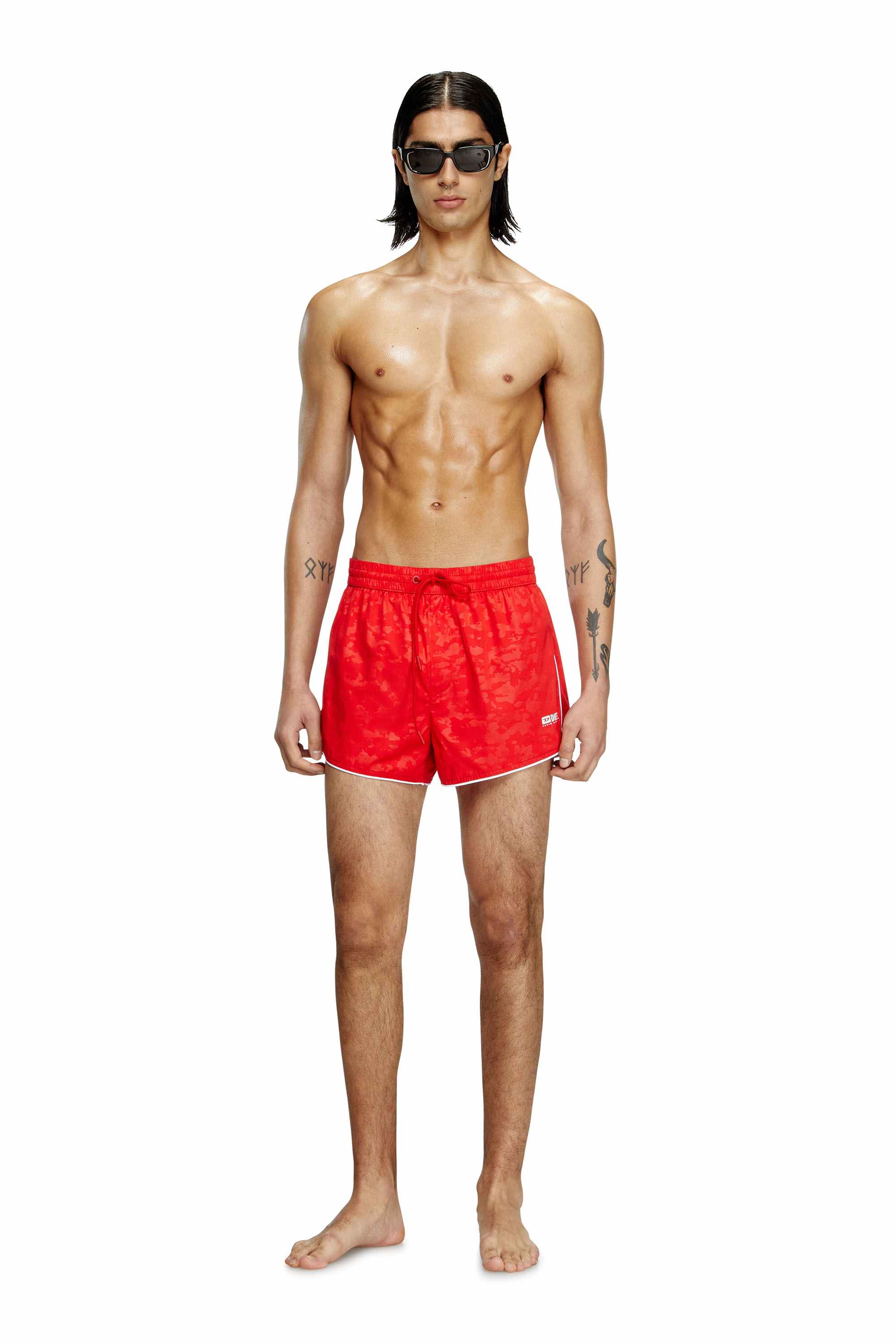 Red Swim shorts with pixelated camo motif