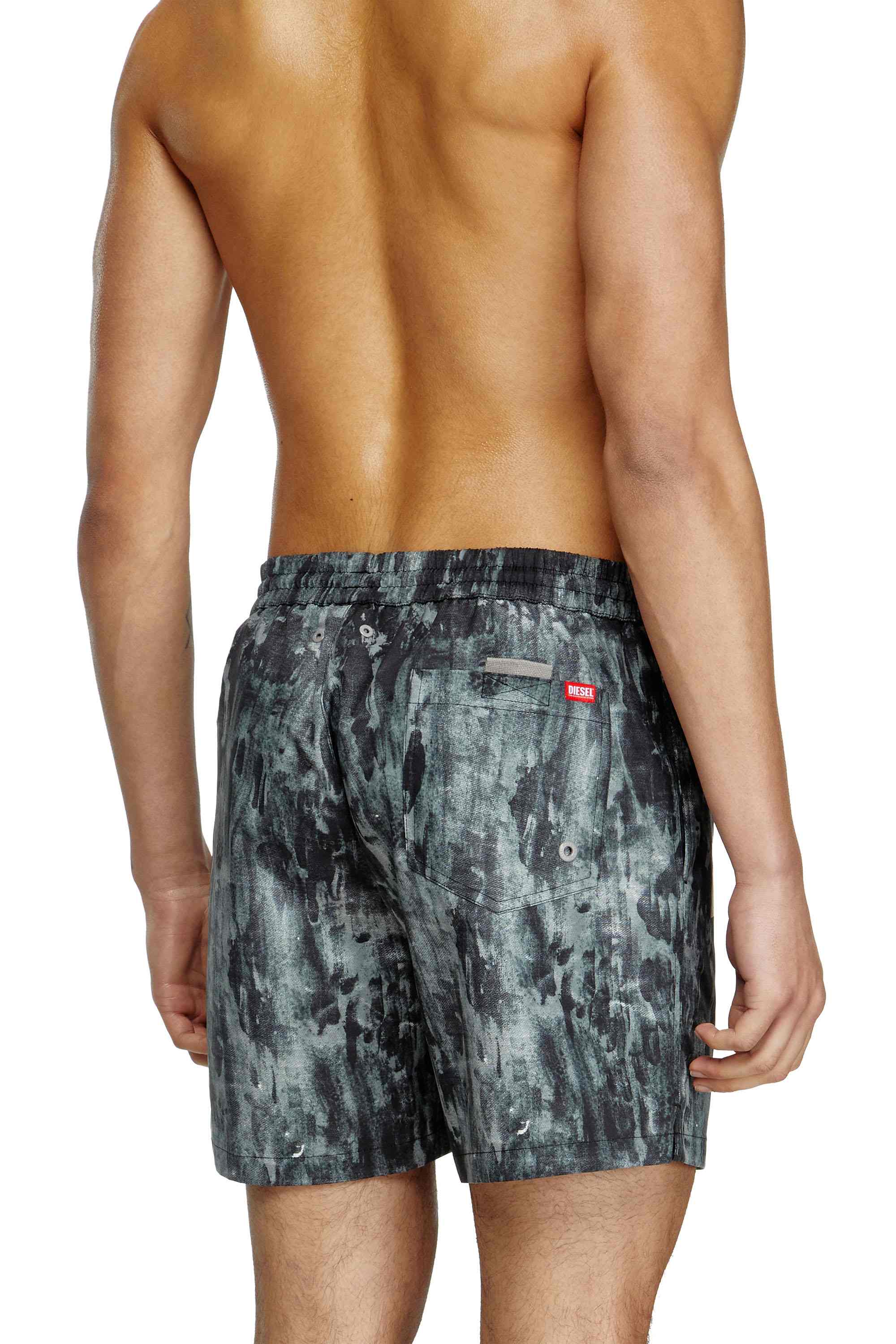 Black Mid-length swim shorts with graphic print
