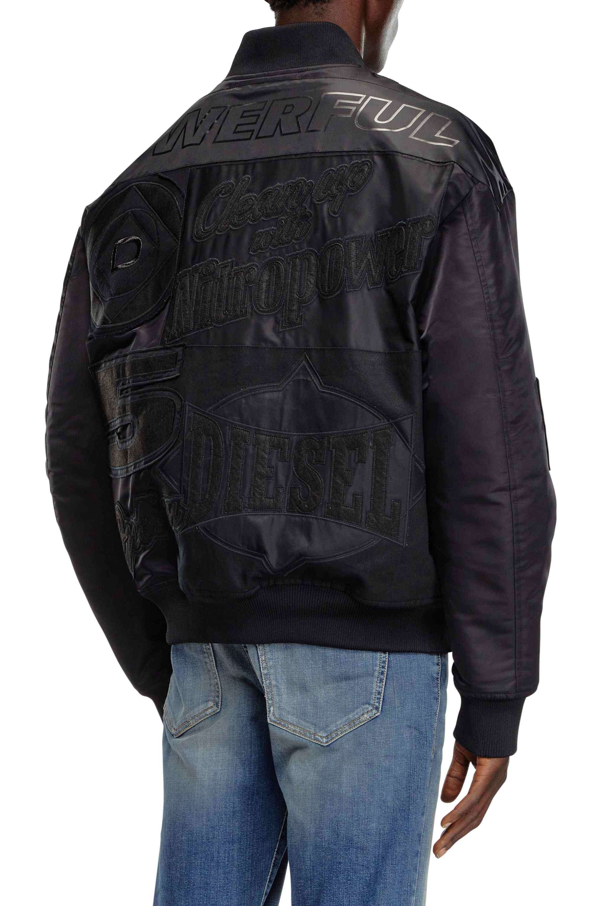 Black Bomber jacket with patches and embroidery