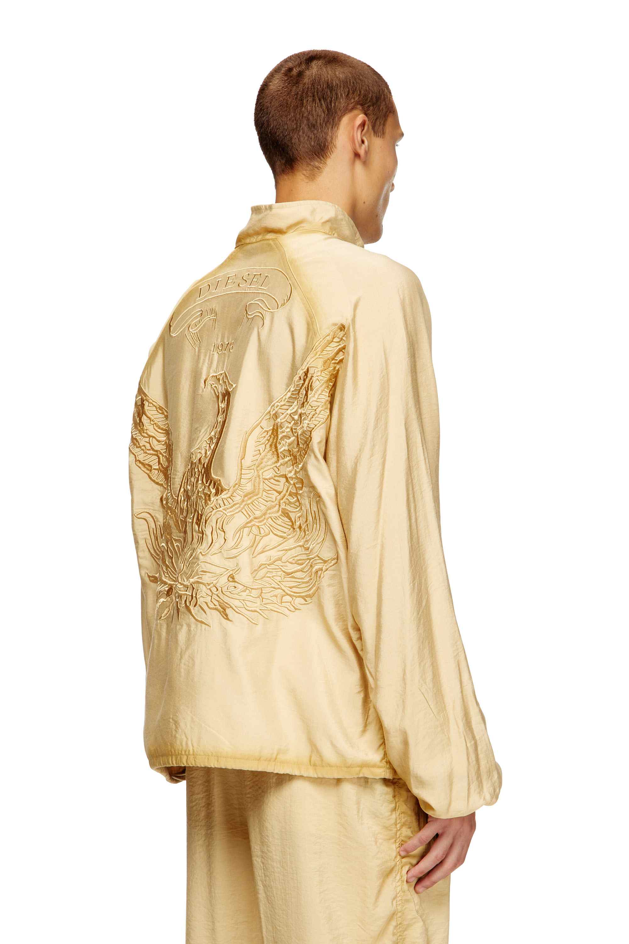 Beige Souvenir-style embroidered track jacket
