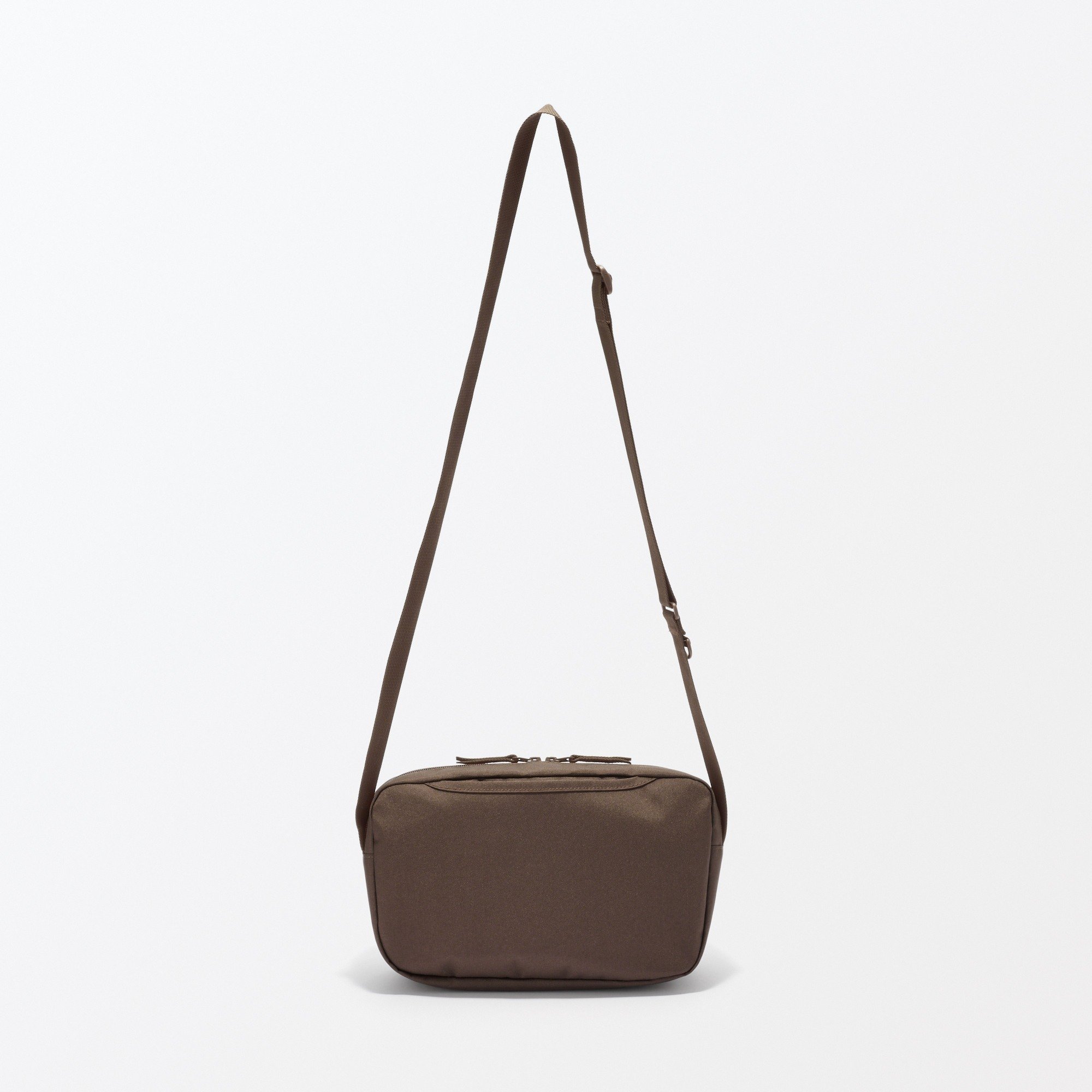 Water repellent shoulder bag with back pocket