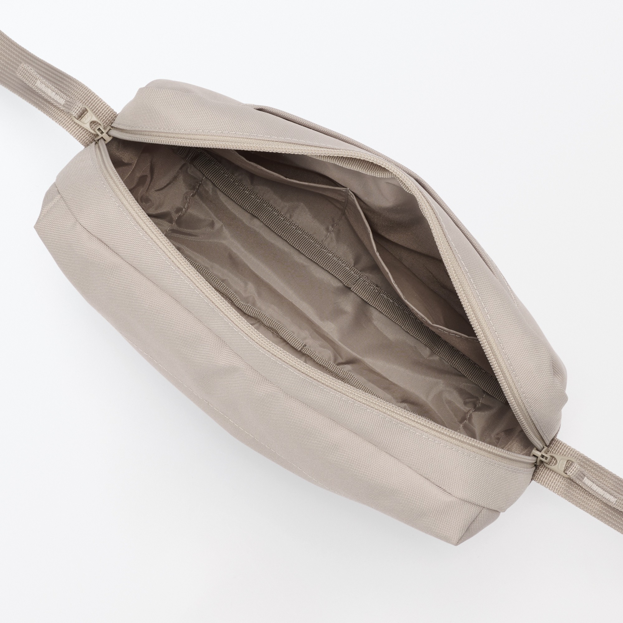 Water repellent shoulder bag with back pocket