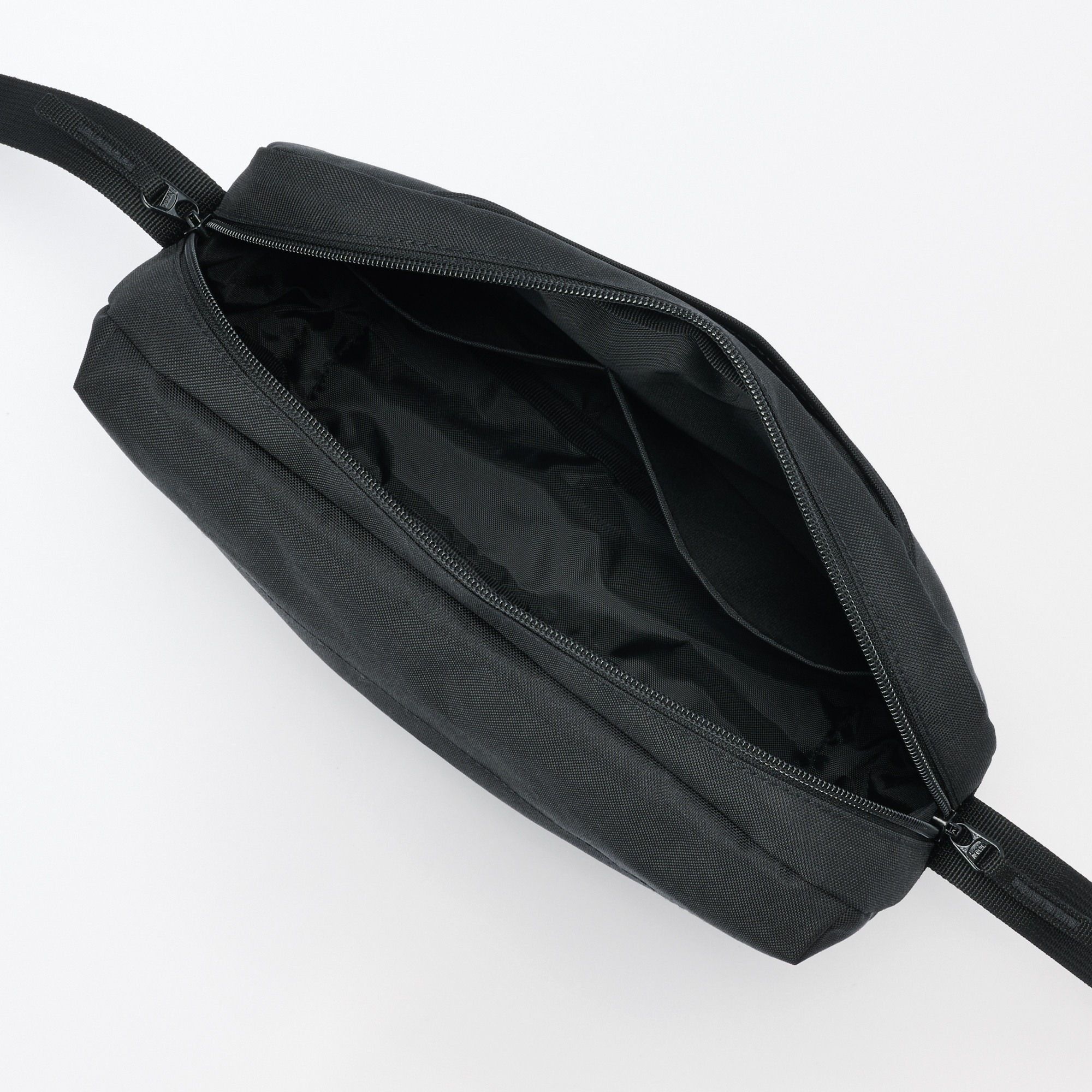 Water repellent shoulder bag with back pocket