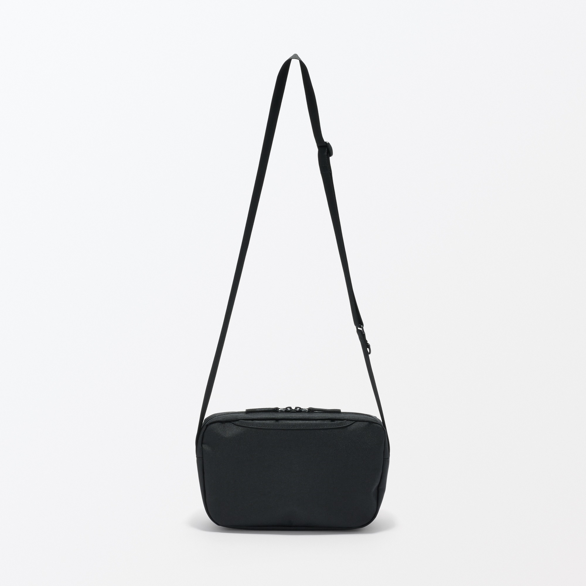 Water repellent shoulder bag with back pocket