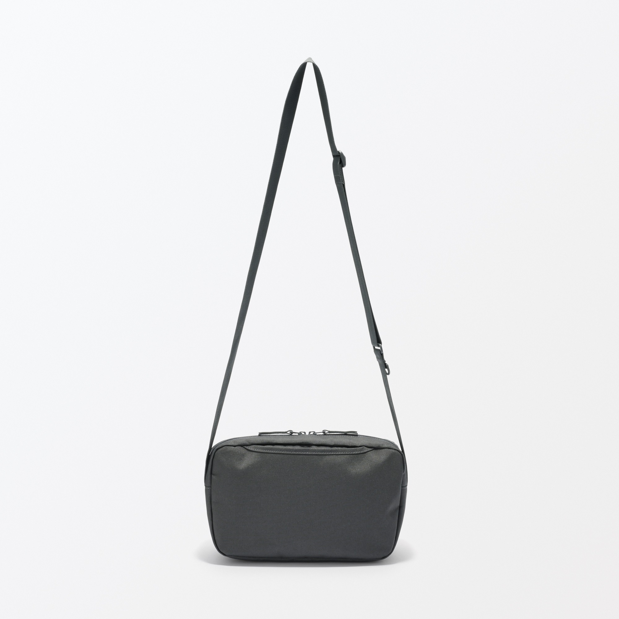 Water repellent shoulder bag with back pocket