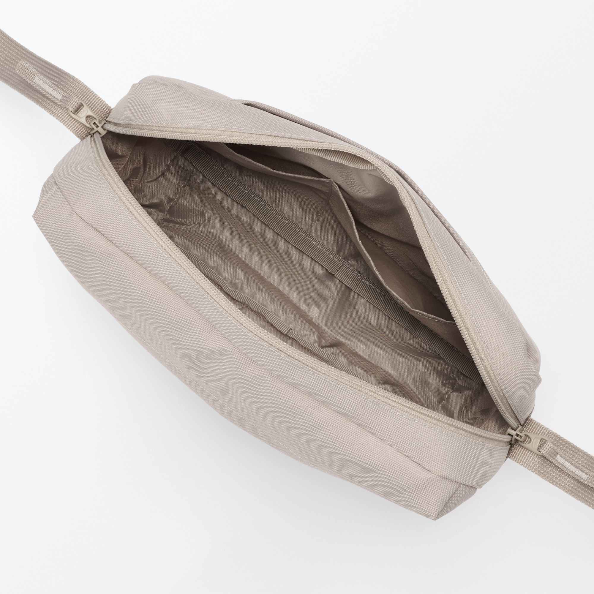 Water repellent shoulder bag with back pocket