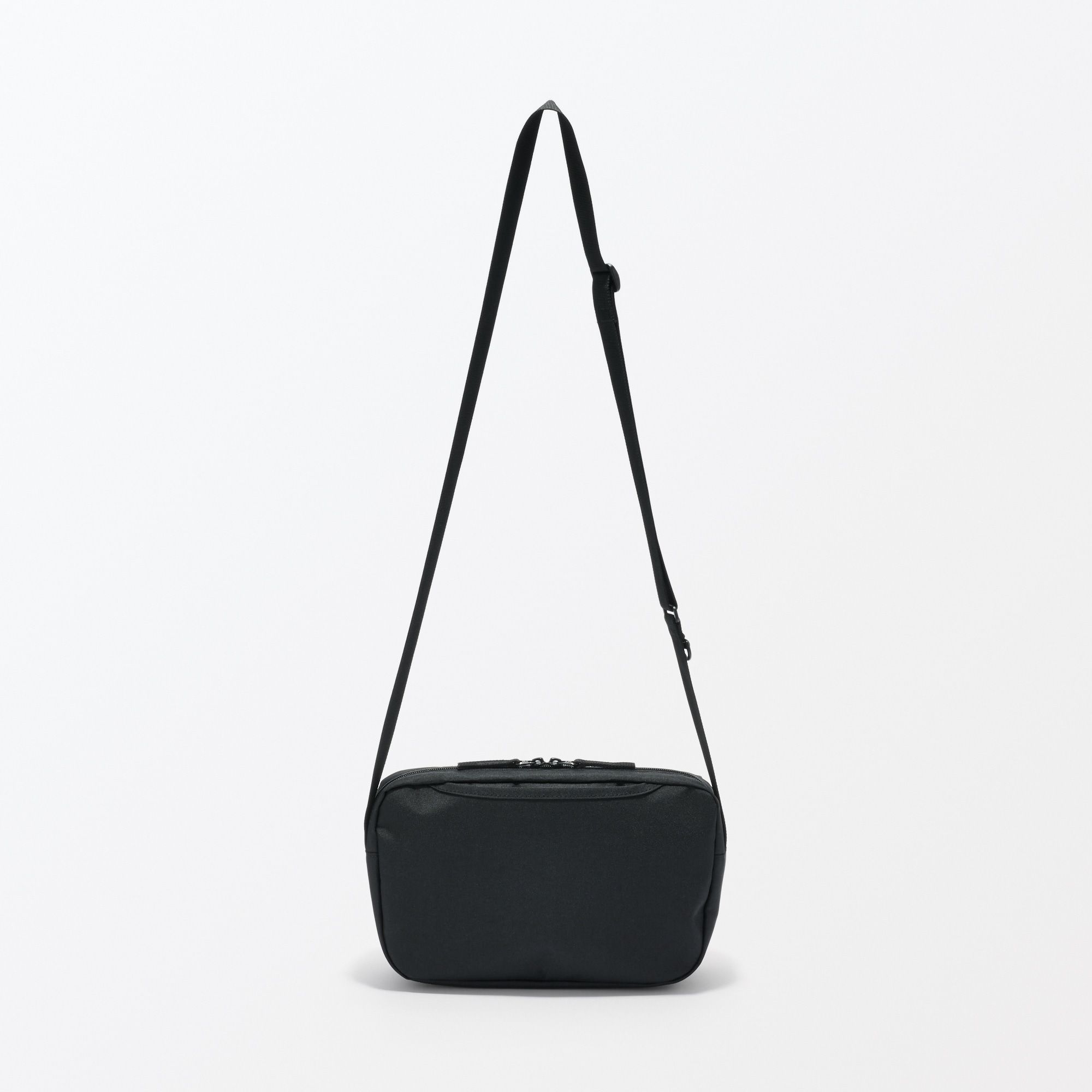 Water repellent shoulder bag with back pocket