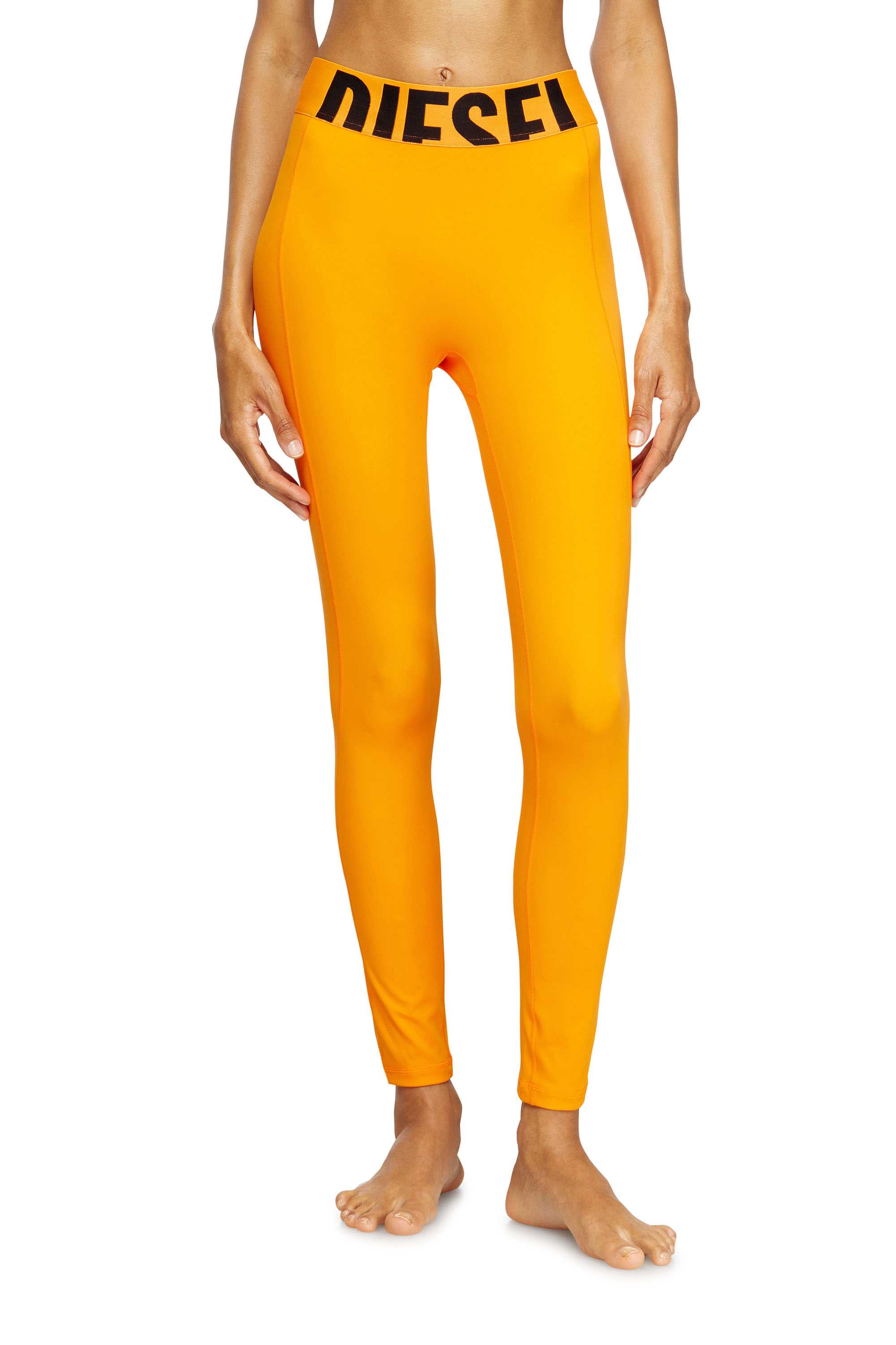 Orange Microfibre leggings with cut-off logo