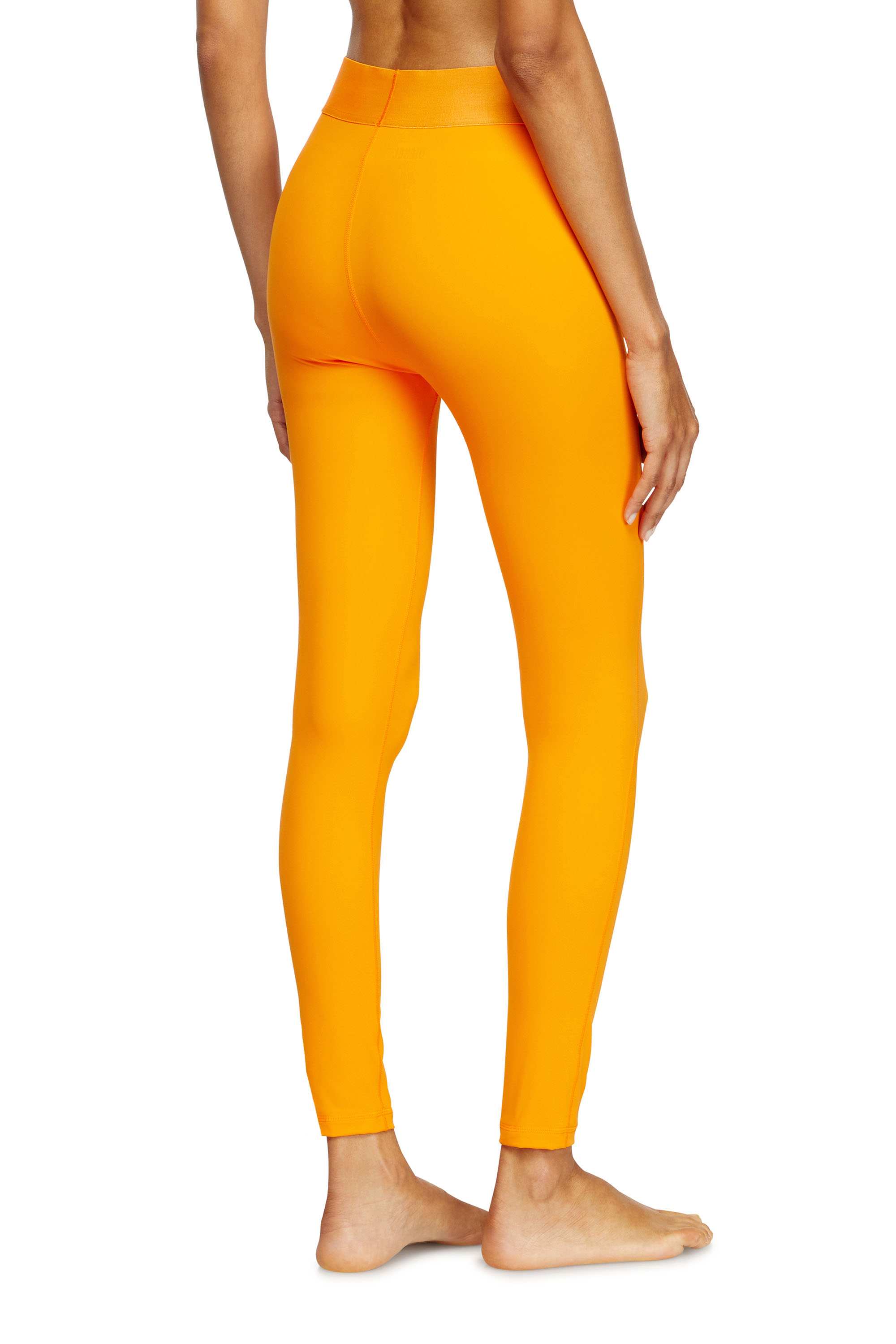 Orange Microfibre leggings with cut-off logo