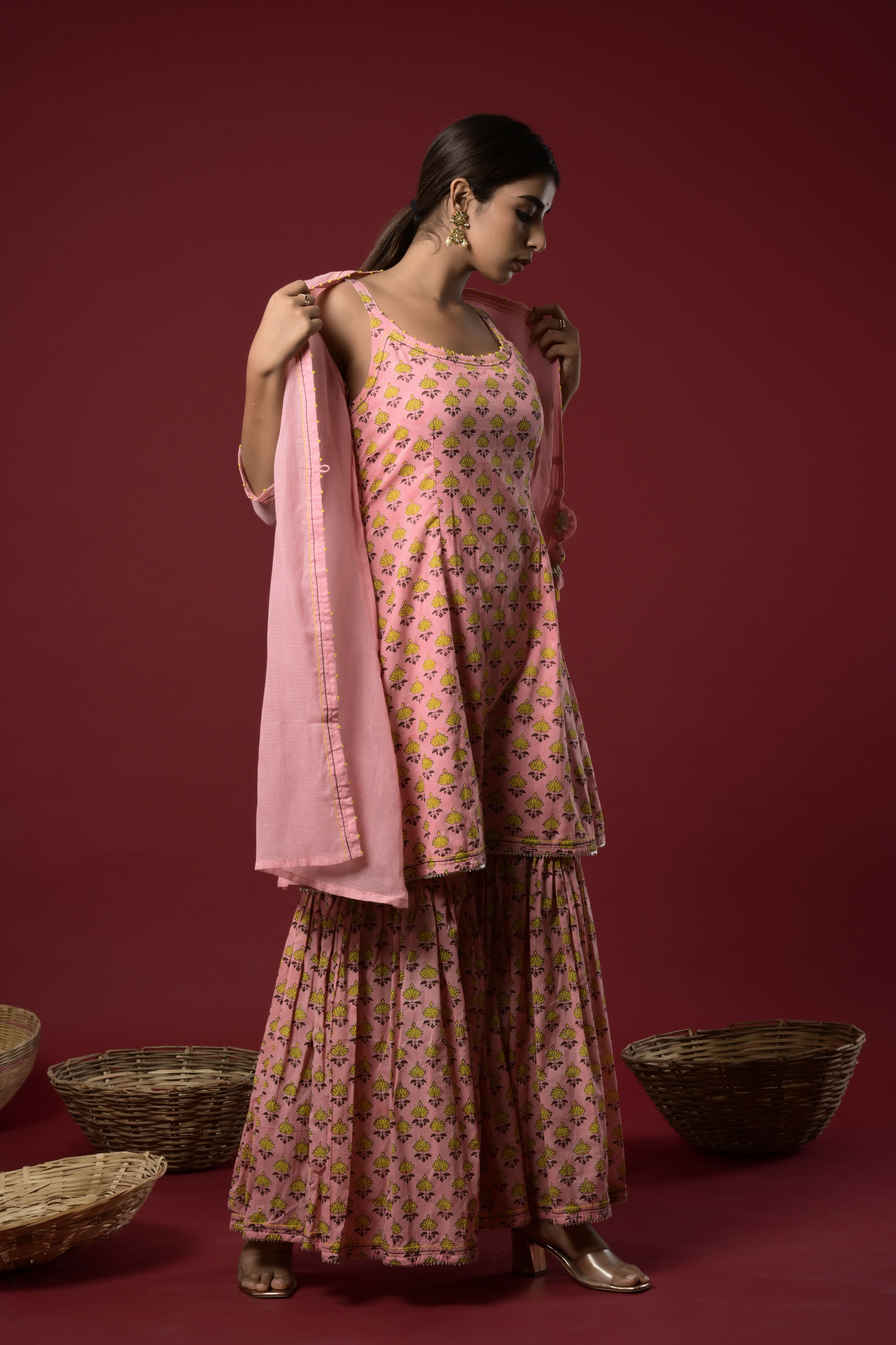 KAARAH BY KAAVYA | Block printed short kurta and sharara with embellishment on the neck and kota doriya jacket with tassel in the front. undefined