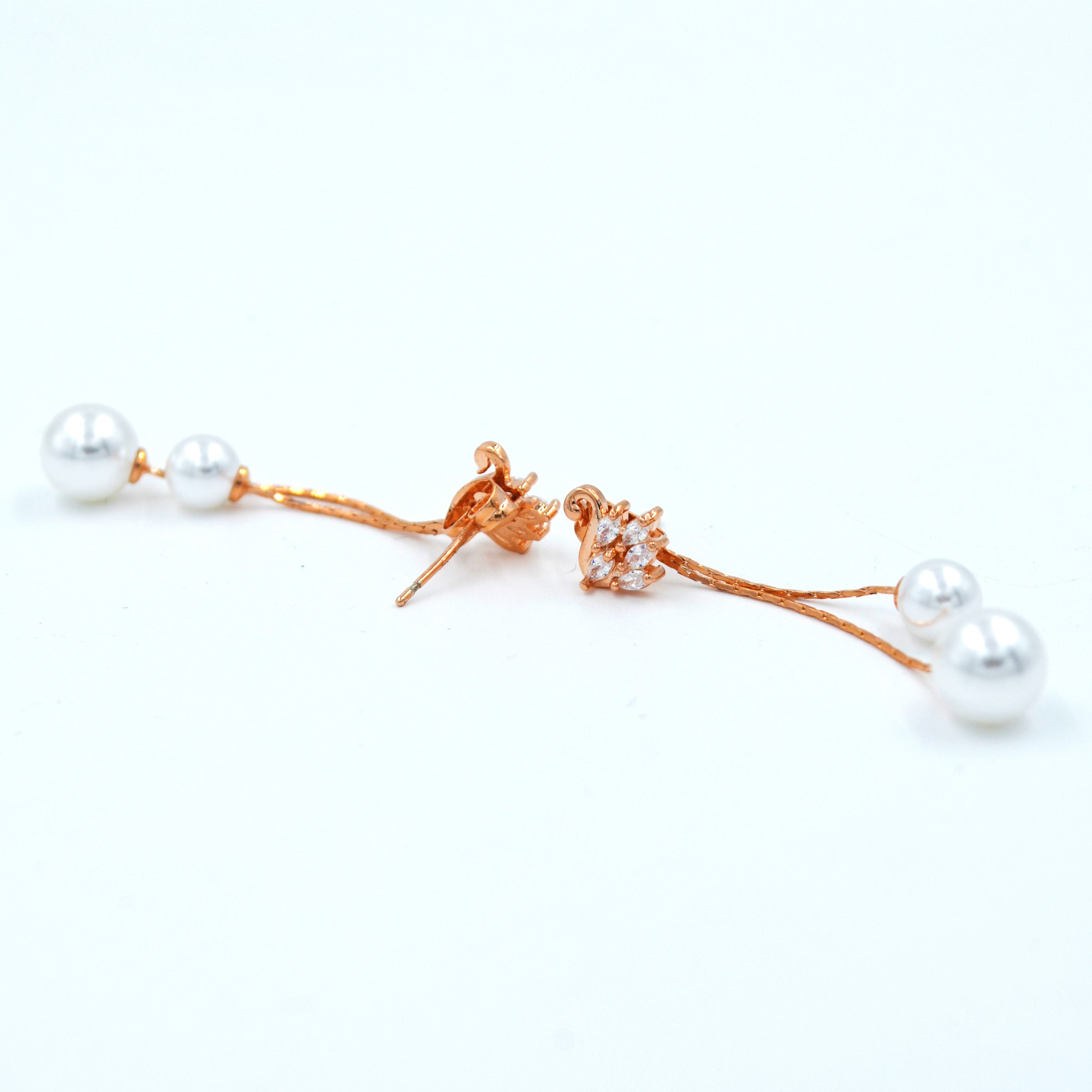 The Nila Rose Gold plated Swan Crystal Top with pearl Danglers
