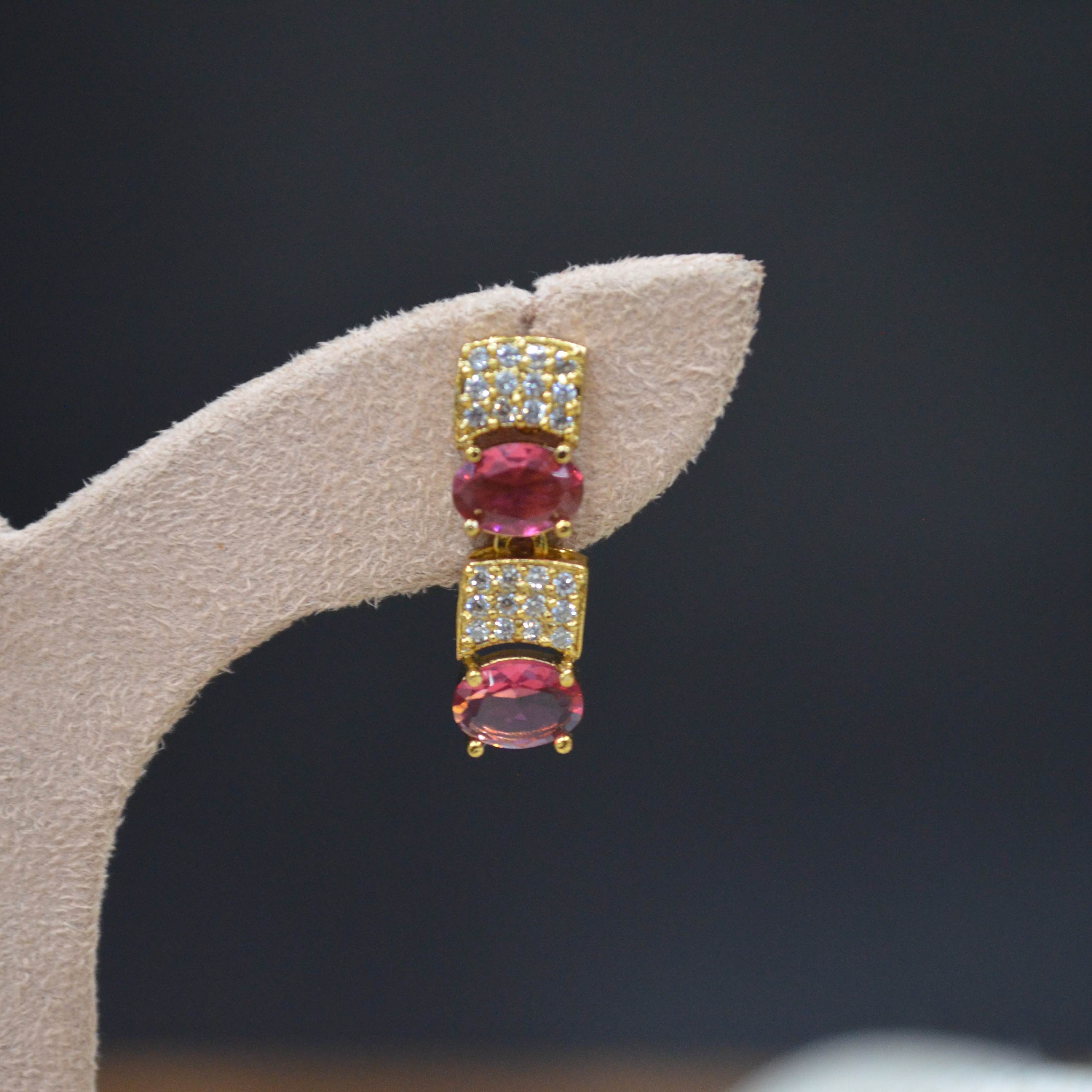 The Nila Gold Plated Crystal and Ruby Sapphire Studded Choker with Drop Earnings