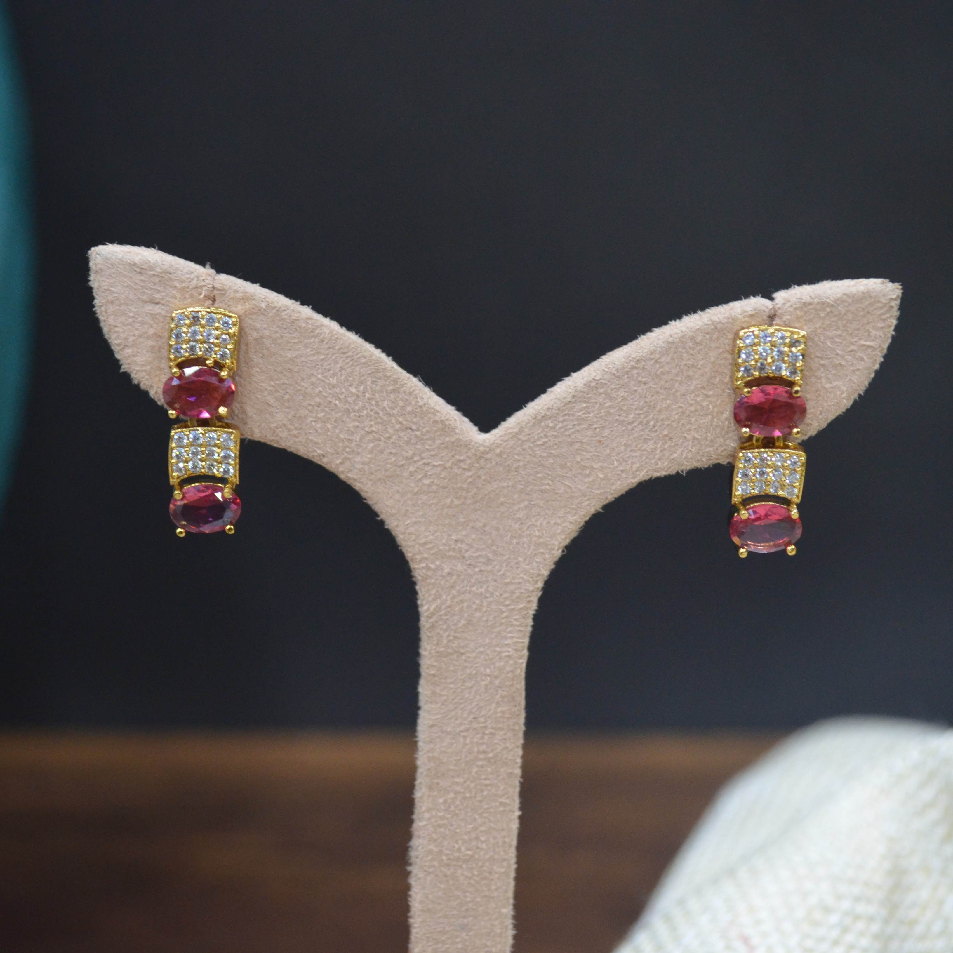 The Nila Gold Plated Crystal and Ruby Sapphire Studded Choker with Drop Earnings