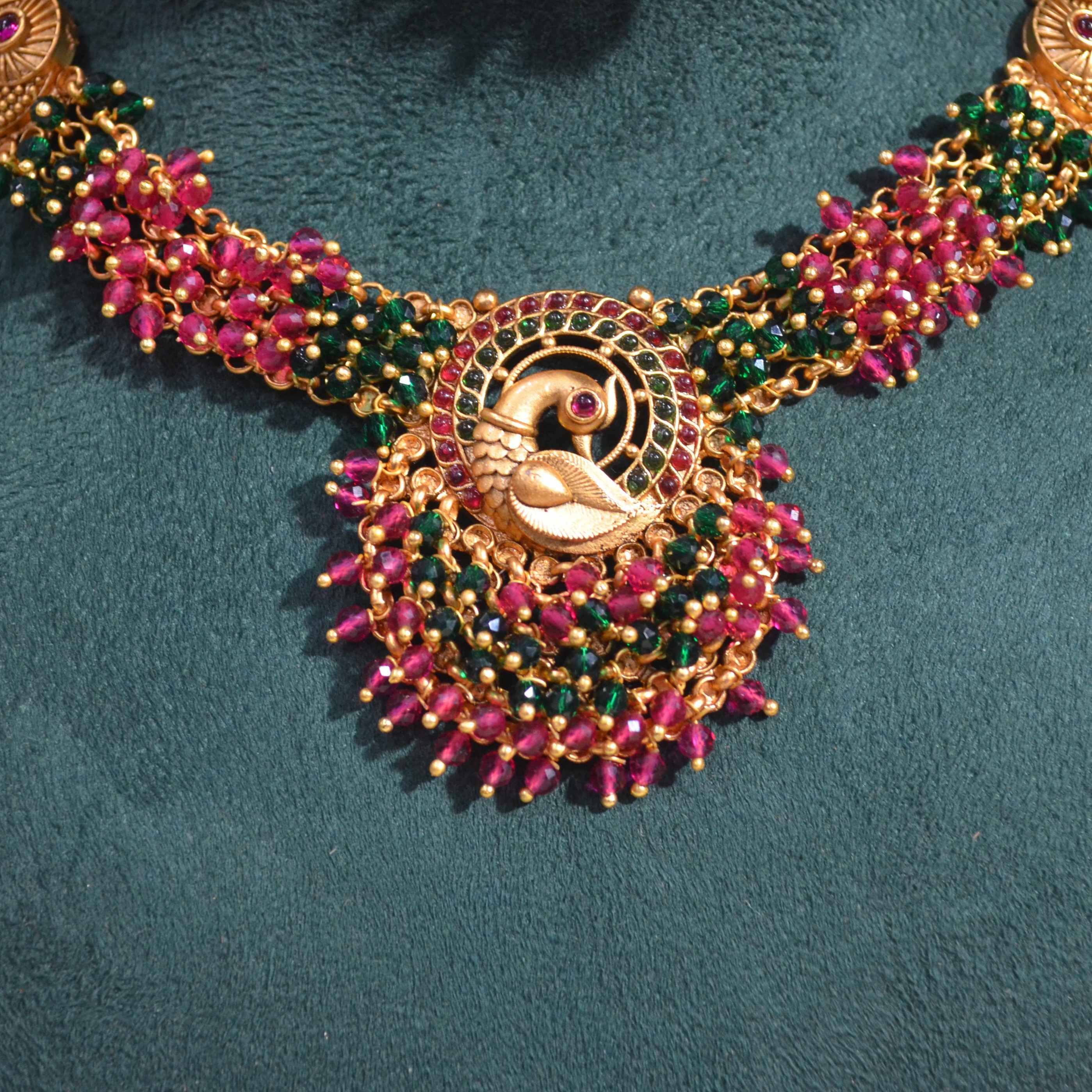 The Nila Gold Plated Peacock Design Kundan Choker Set