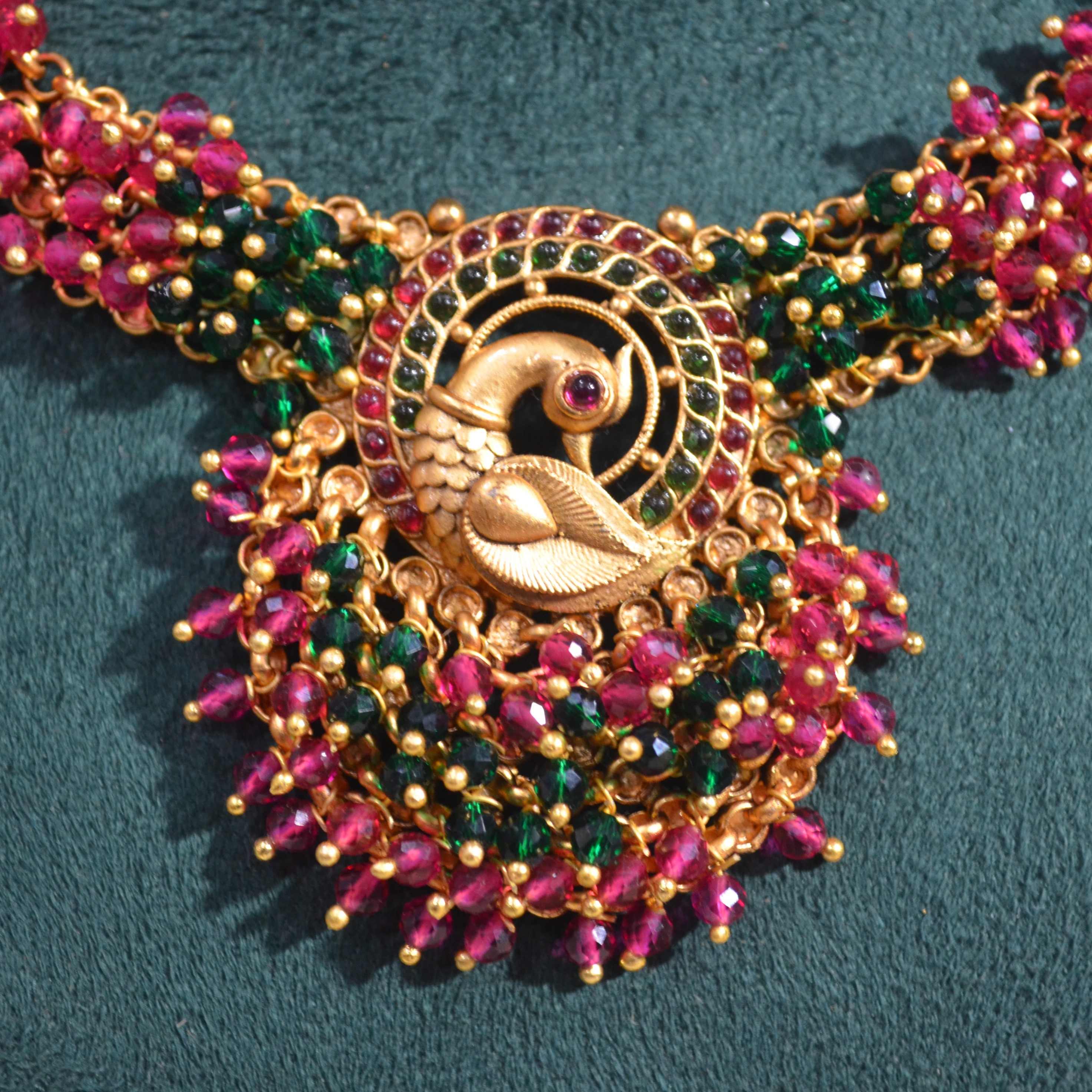 The Nila Gold Plated Peacock Design Kundan Choker Set