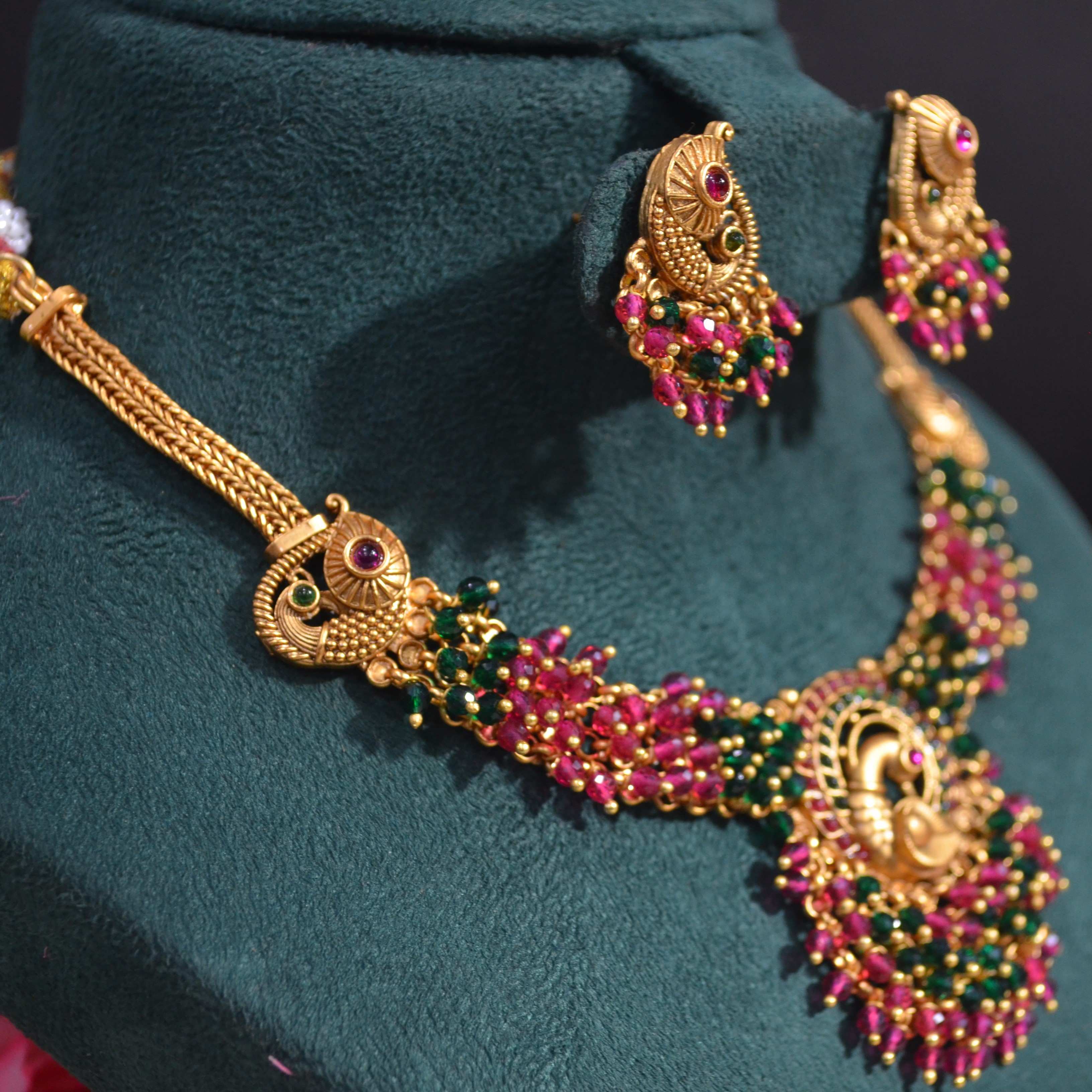 The Nila Gold Plated Peacock Design Kundan Choker Set