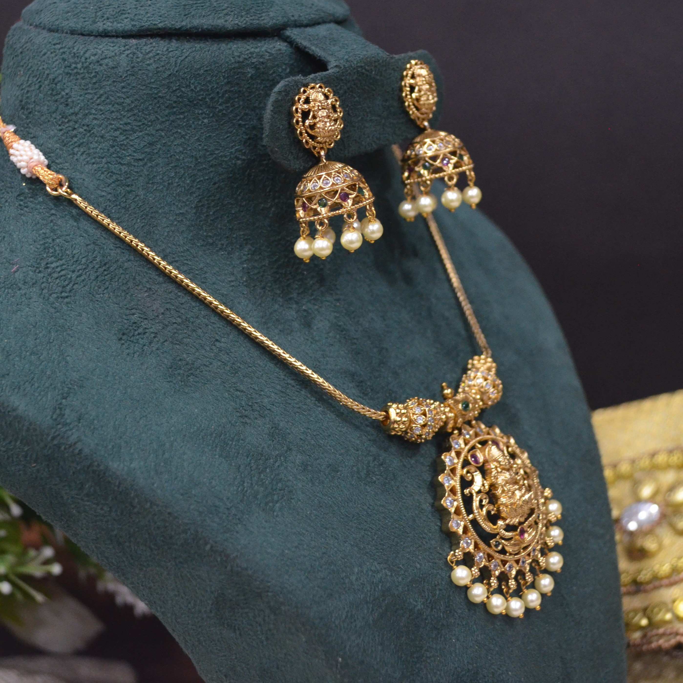 The Nila Gold Plated Temple Design Pendant Chain with Pearl Jhumkas