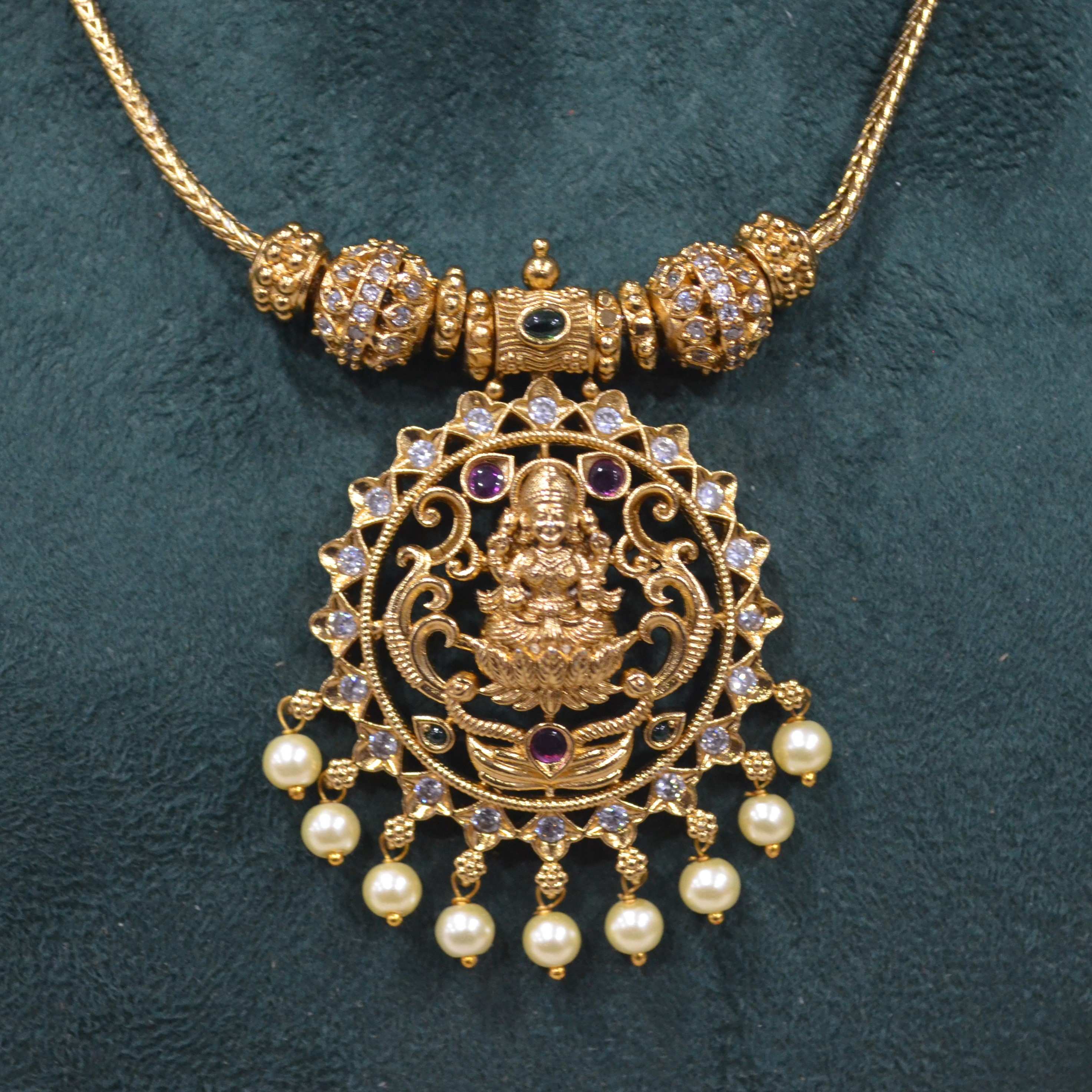 The Nila Gold Plated Temple Design Pendant Chain with Pearl Jhumkas