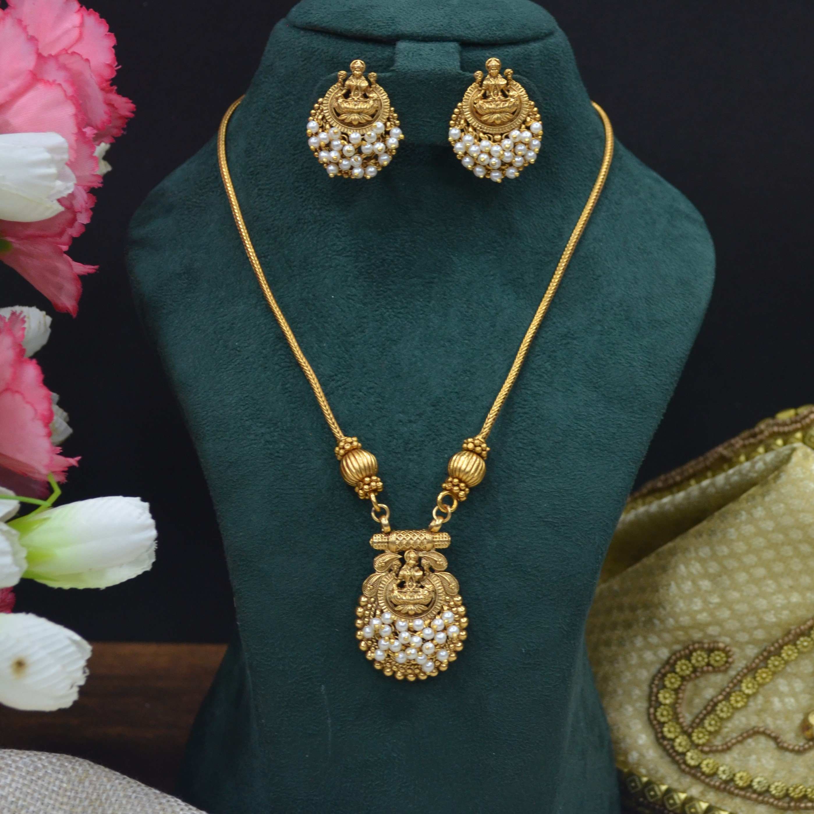 The Nila Gold Plated Temple Design Pendant Chain with Pearl Tops Earrings