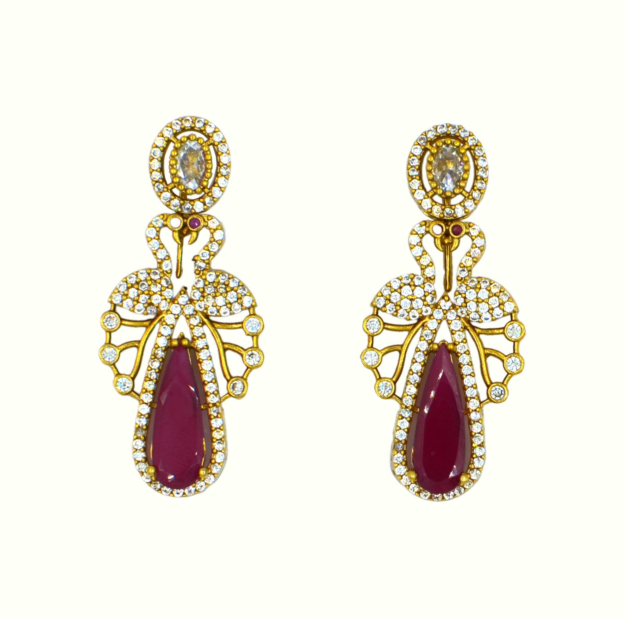 The Nila Gold Plated Peacock Design Crystal Necklace with Teardrop Ruby Drop Earrings