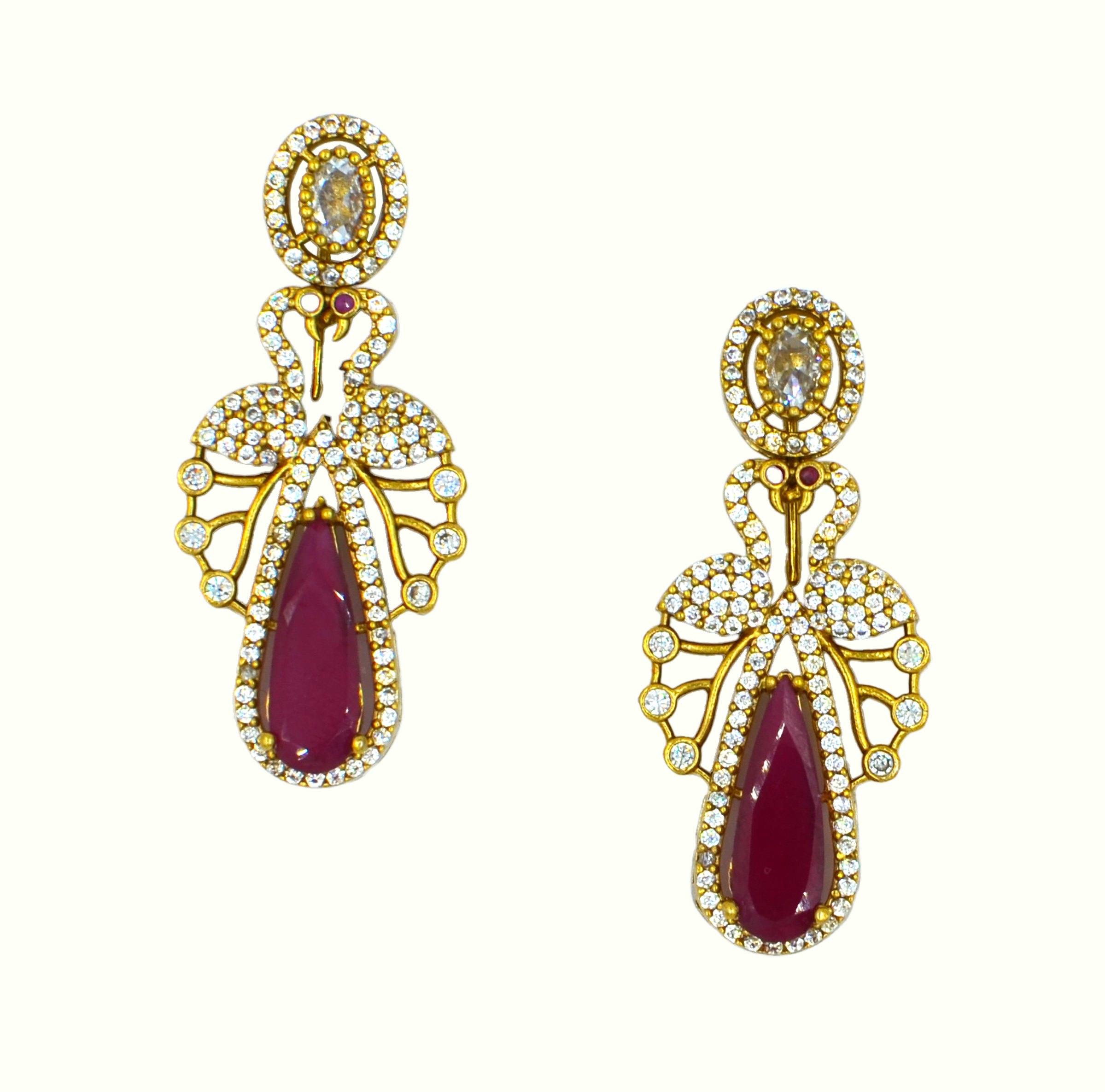 The Nila Gold Plated Peacock Design Crystal Necklace with Teardrop Ruby Drop Earrings