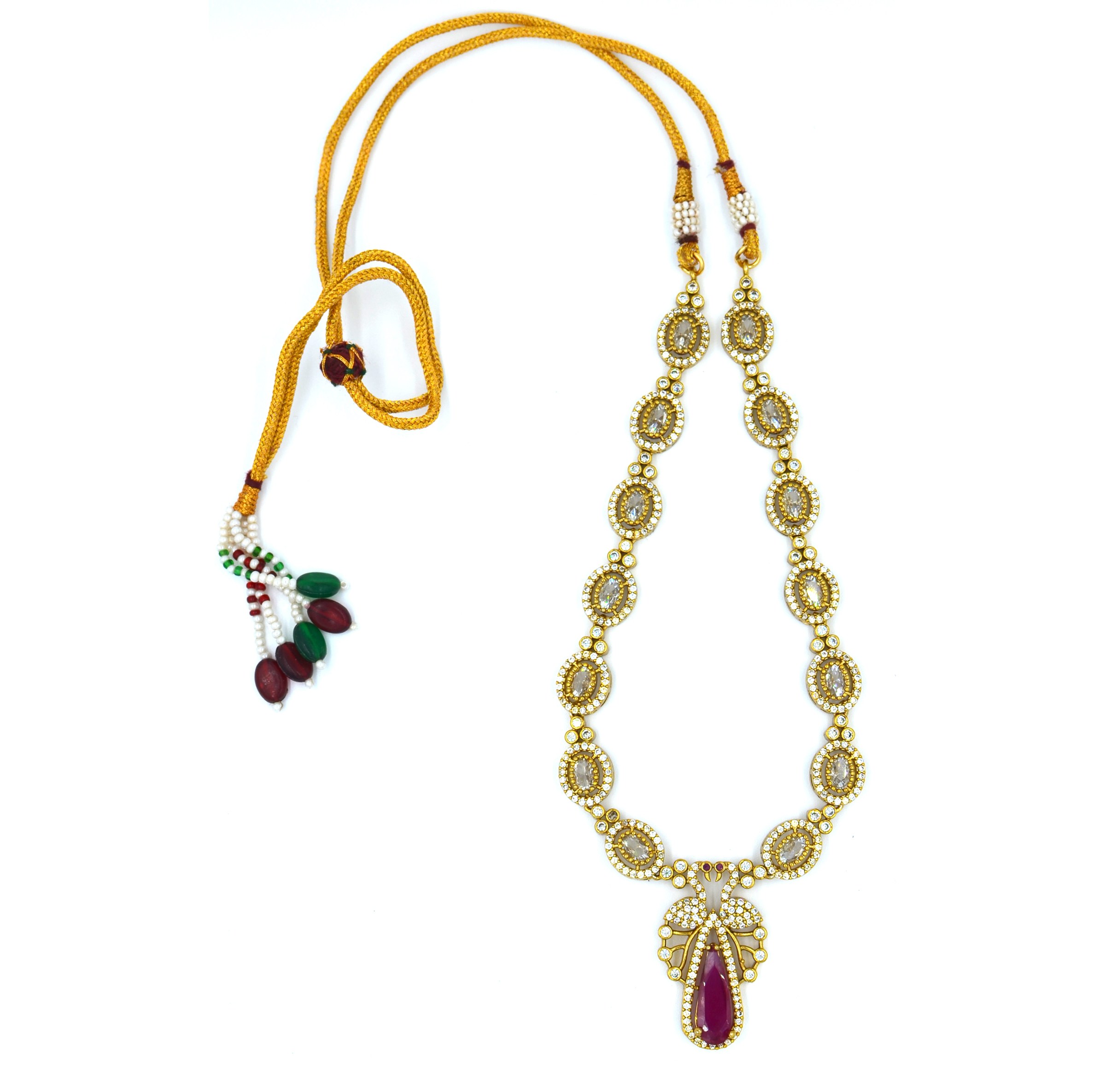 The Nila Gold Plated Peacock Design Crystal Necklace with Teardrop Ruby Drop Earrings