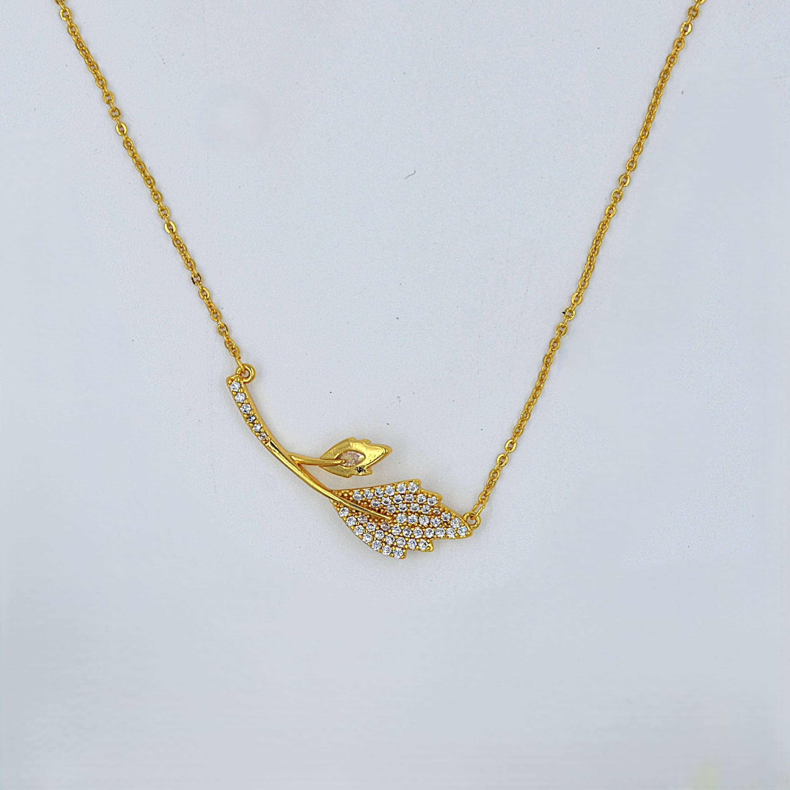 The Nila Gold Plated Leaf Design Stone Studded Chain