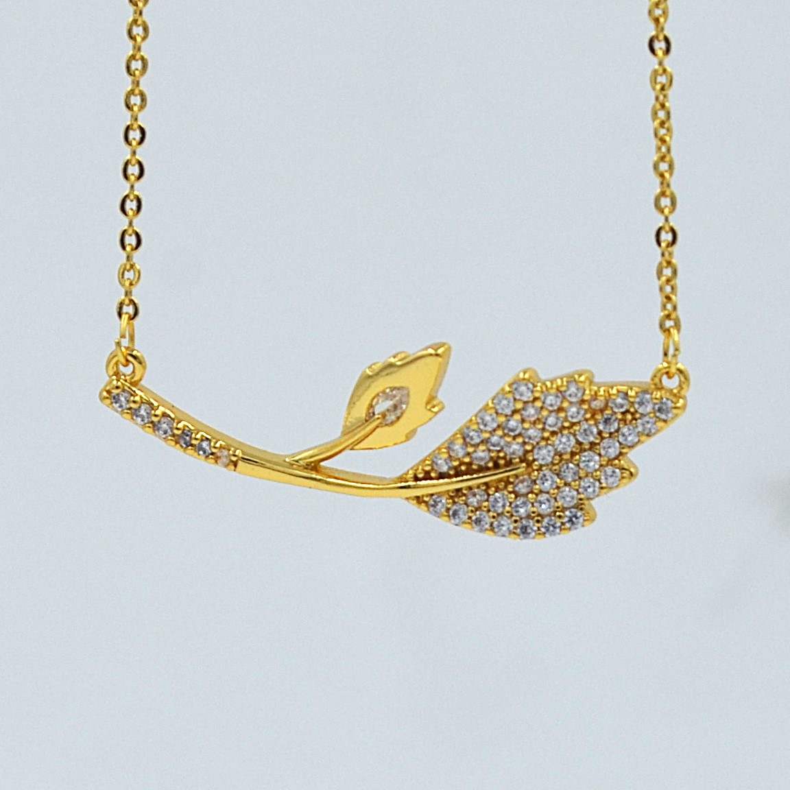 The Nila Gold Plated Leaf Design Stone Studded Chain