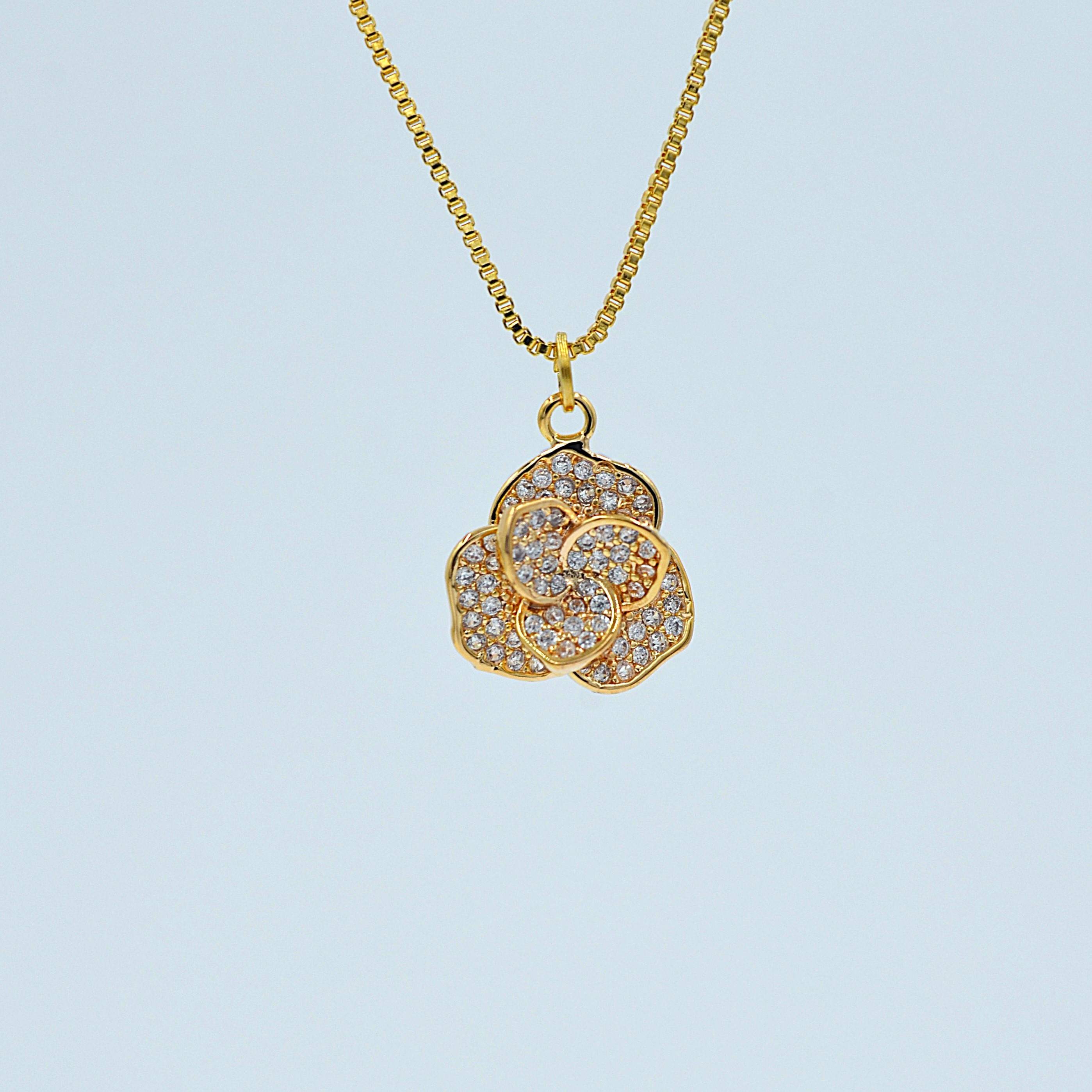 The Nila Gold plated Floral pendant chain with Stud earrings