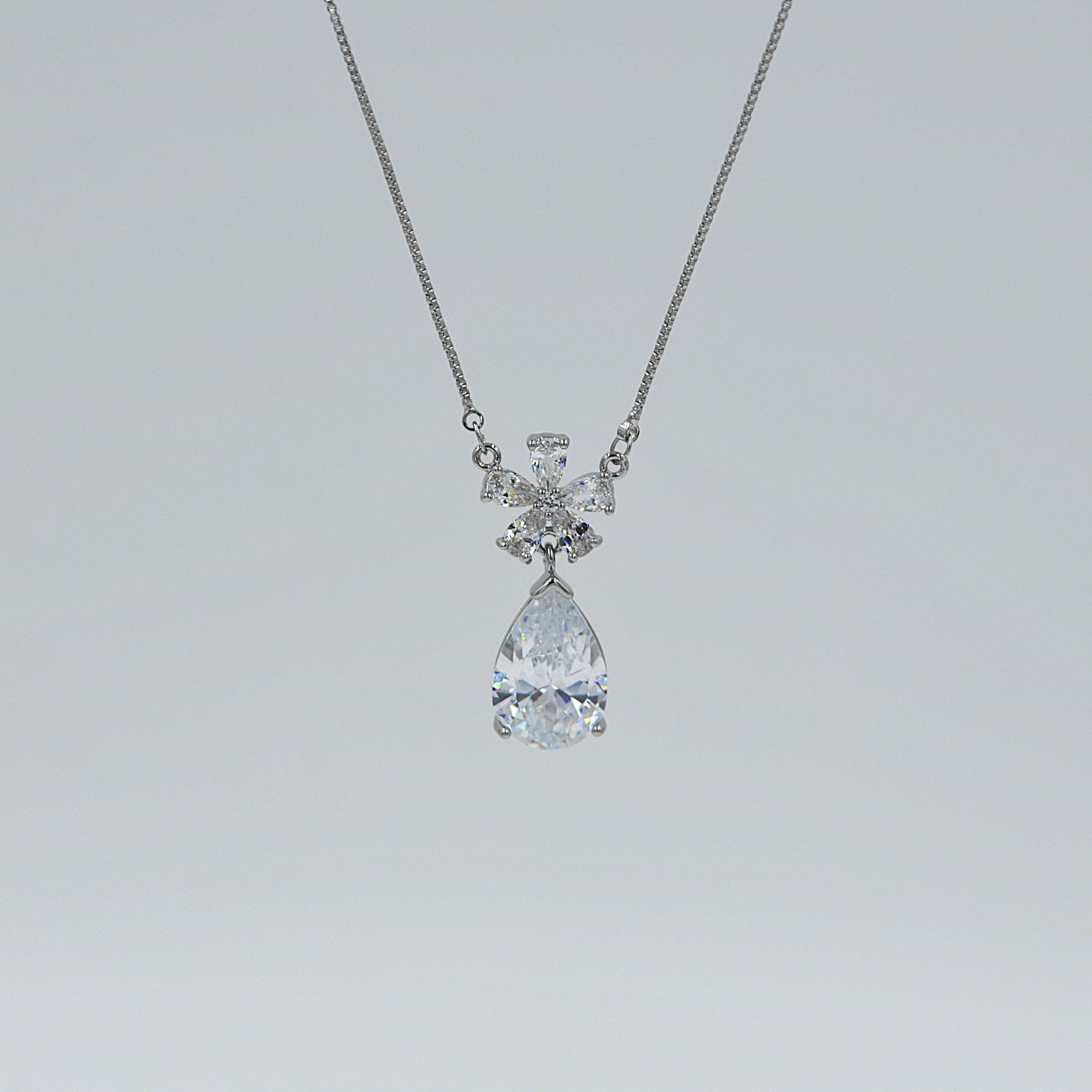 The Nila Silver Plated Solitaire Dew Drop Pendant chain with Earrings