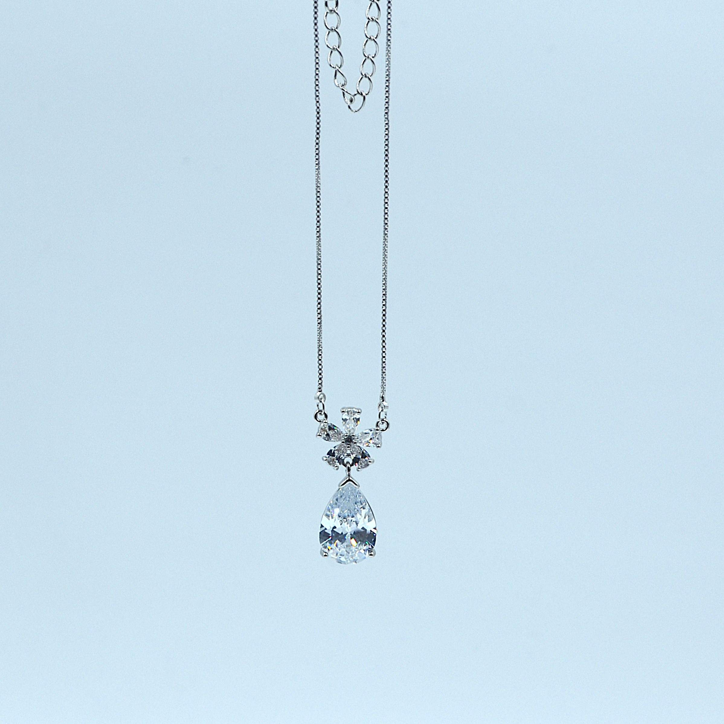 The Nila Silver Plated Solitaire Dew Drop Pendant chain with Earrings