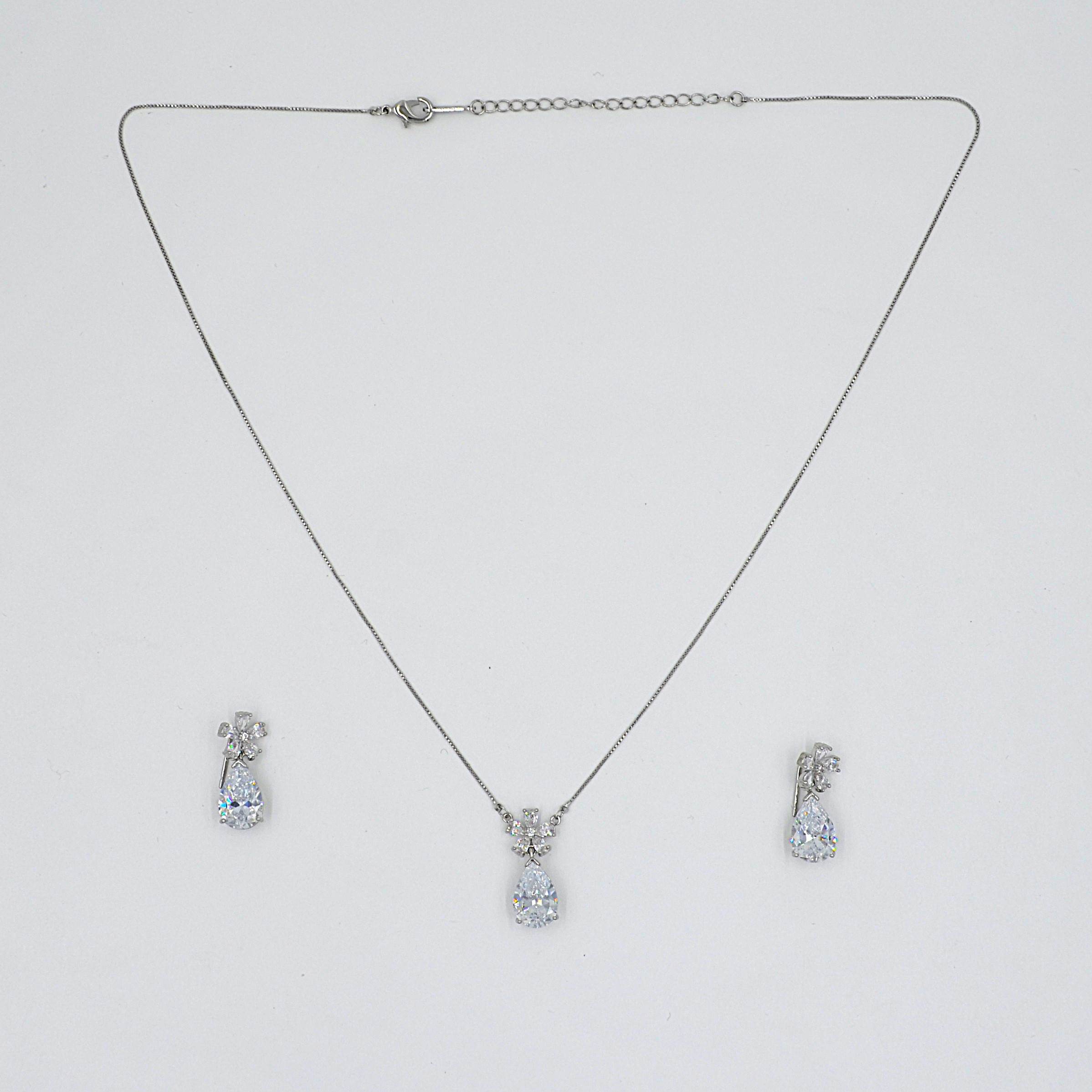 The Nila Silver Plated Solitaire Dew Drop Pendant chain with Earrings