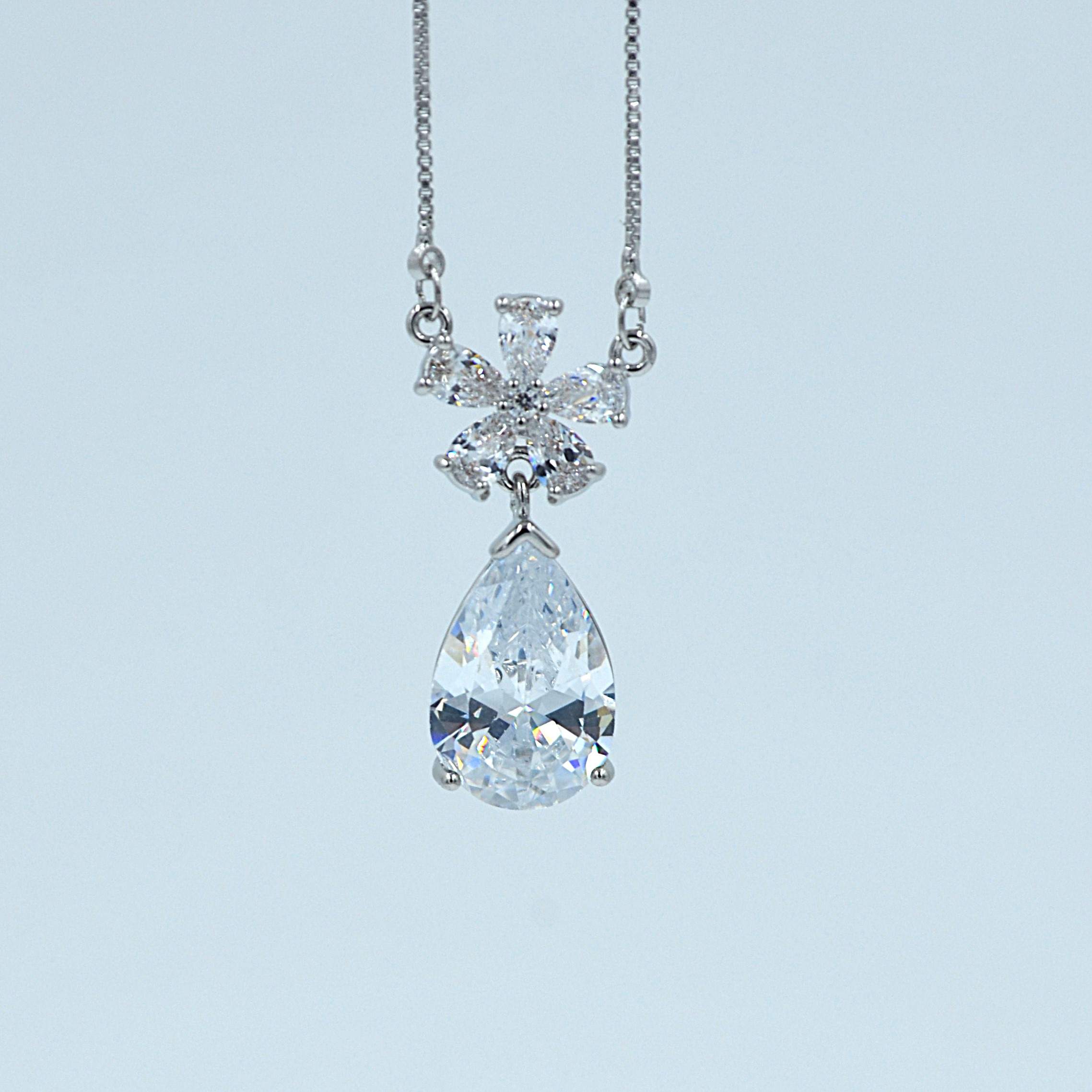 The Nila Silver Plated Solitaire Dew Drop Pendant chain with Earrings