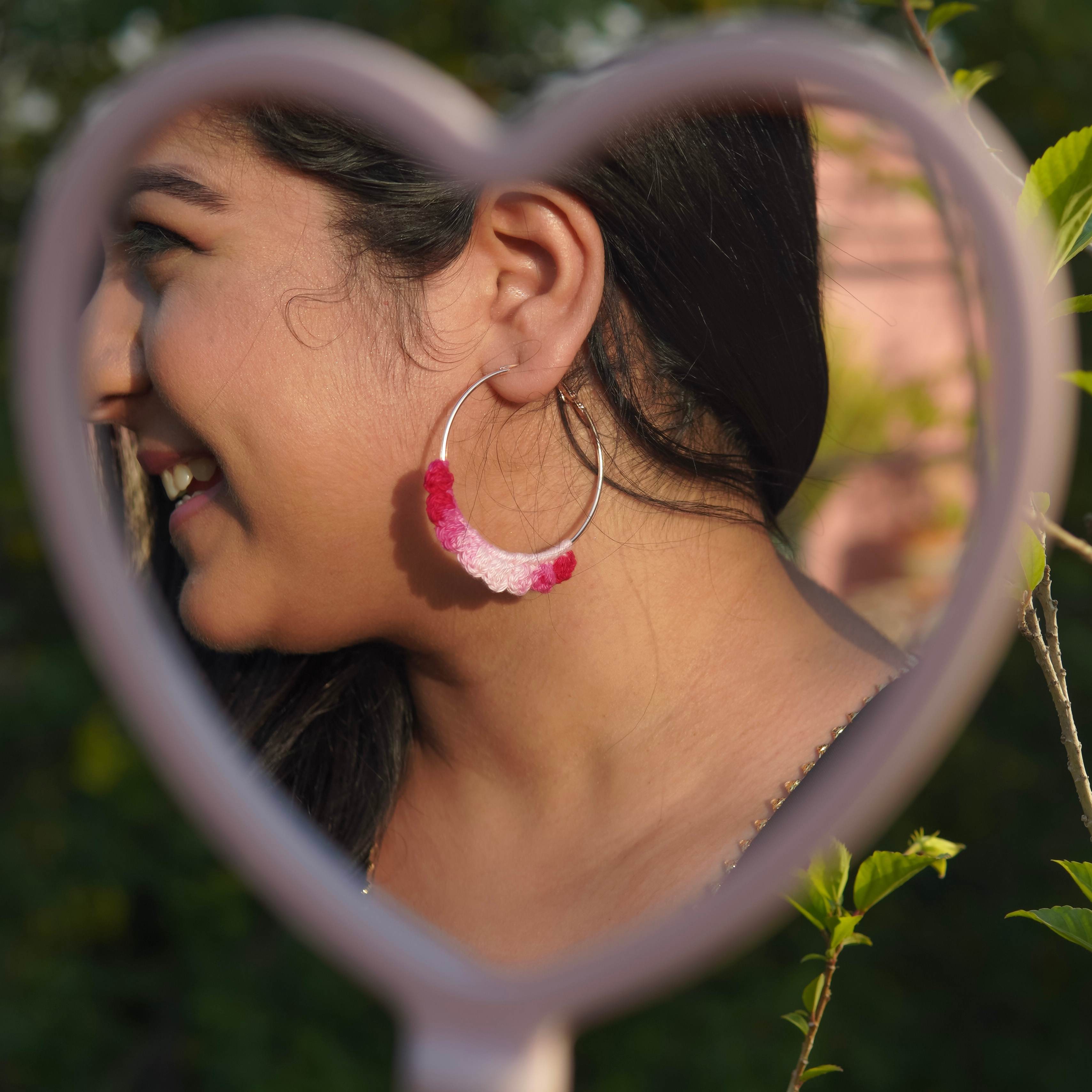 Model wearing the Dual Pink Crochet Nazakat Hoops by AHG. Perfect for everyday style!