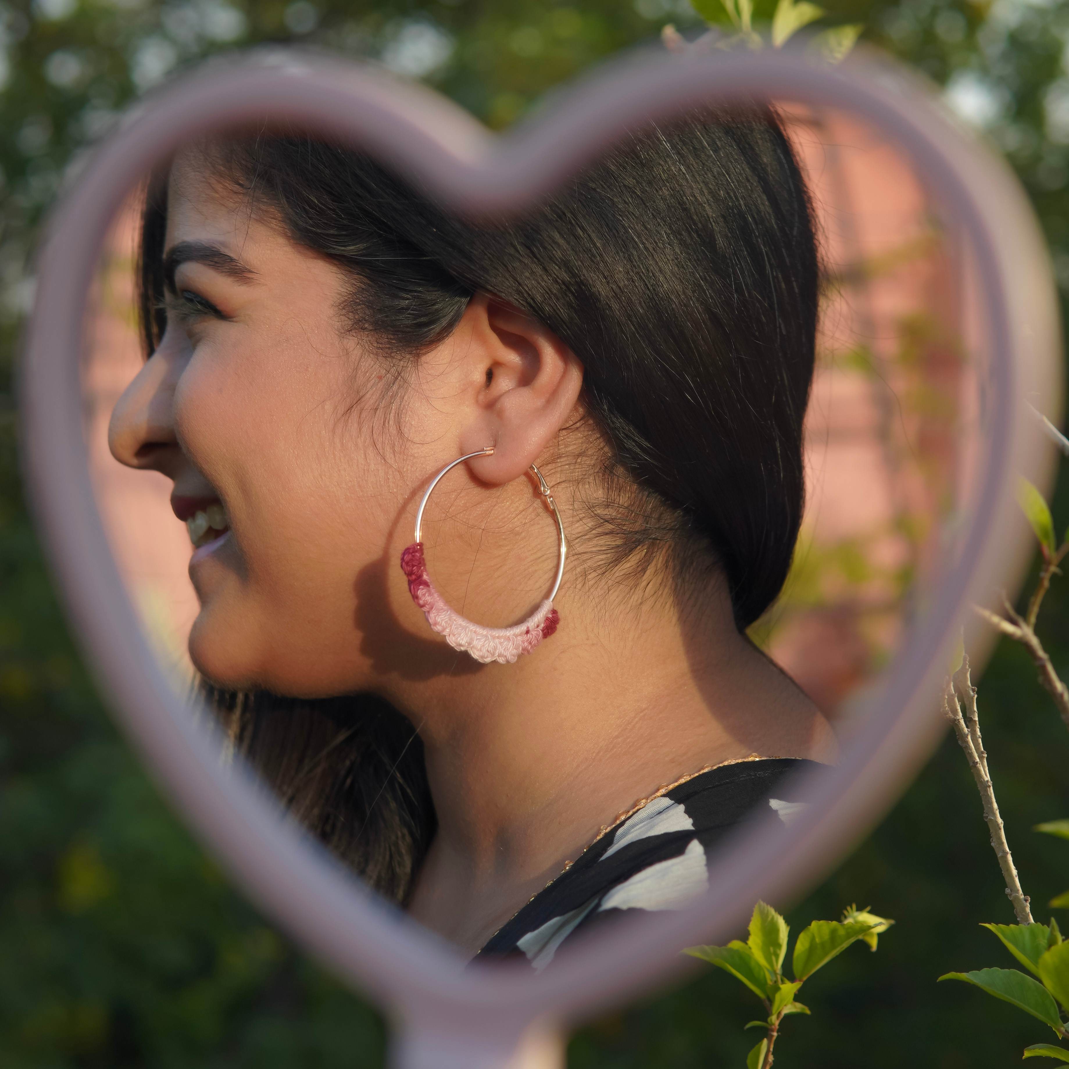 Model wearing the Wine Crochet Nazakat Hoops by AHG. Perfect for any outfit!