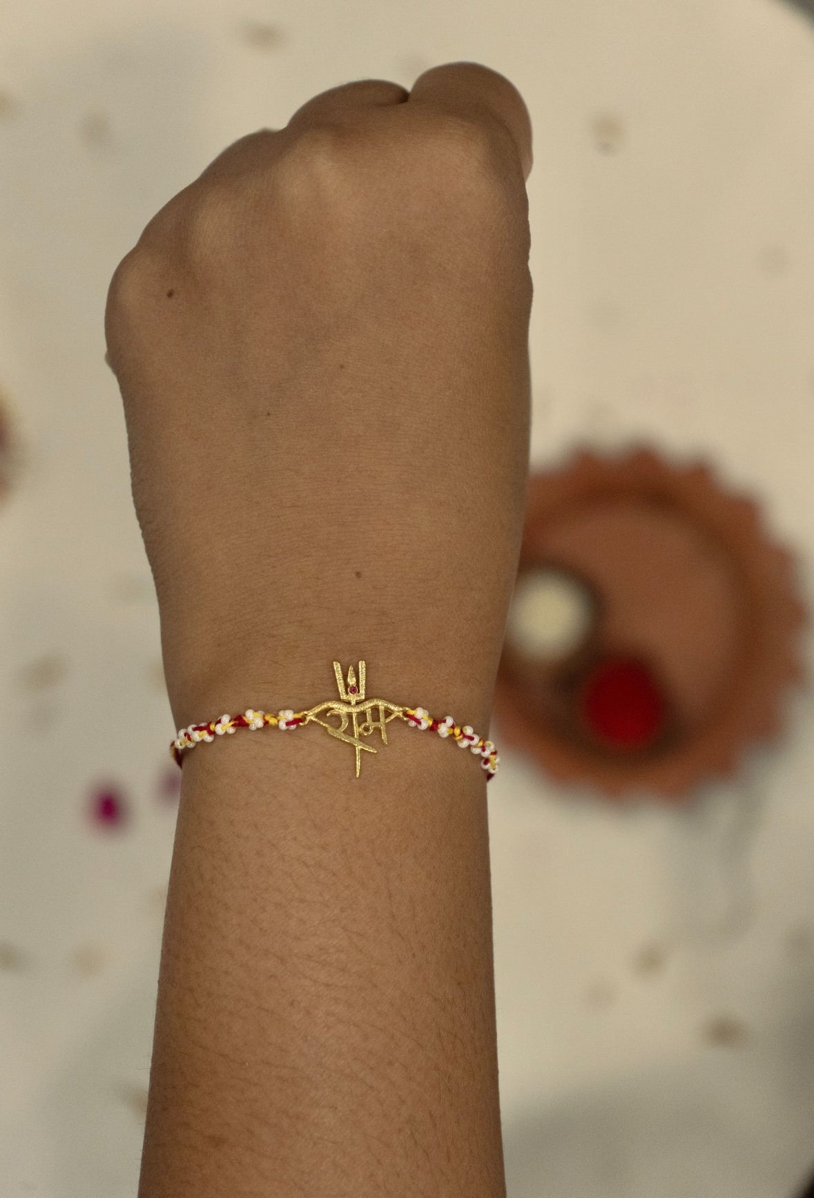 Ram Rakhi in 18k plated gold