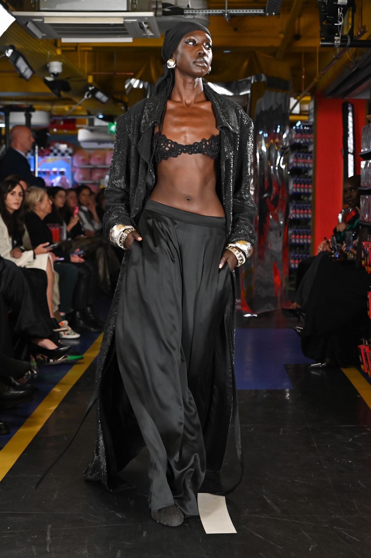 Long Black Jacket with Leather Stacking with Cord Bra Top and Silk Broad Trouser