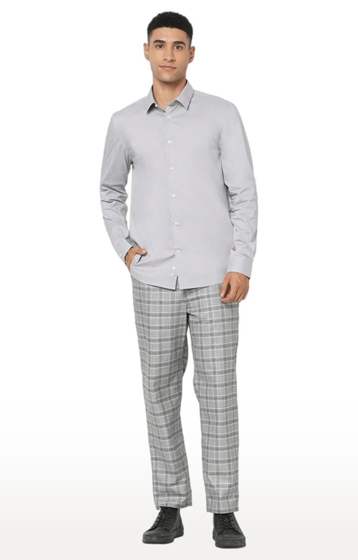 Men's white shirt and grey pants outfit