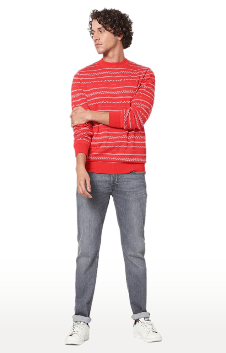 striped sweater and red jeans