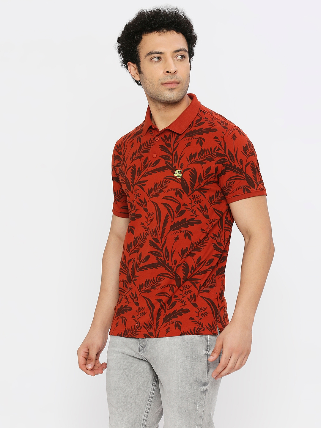spykar | Spykar Men Burnt Orange Blended Regular Fit Half Sleeve Floral Print Polo Tshirt 1