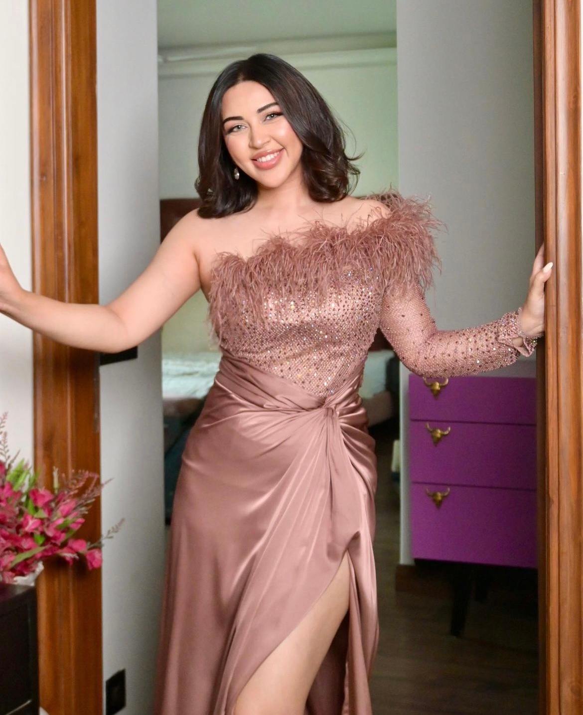 Rose gold off shoulder feather gown