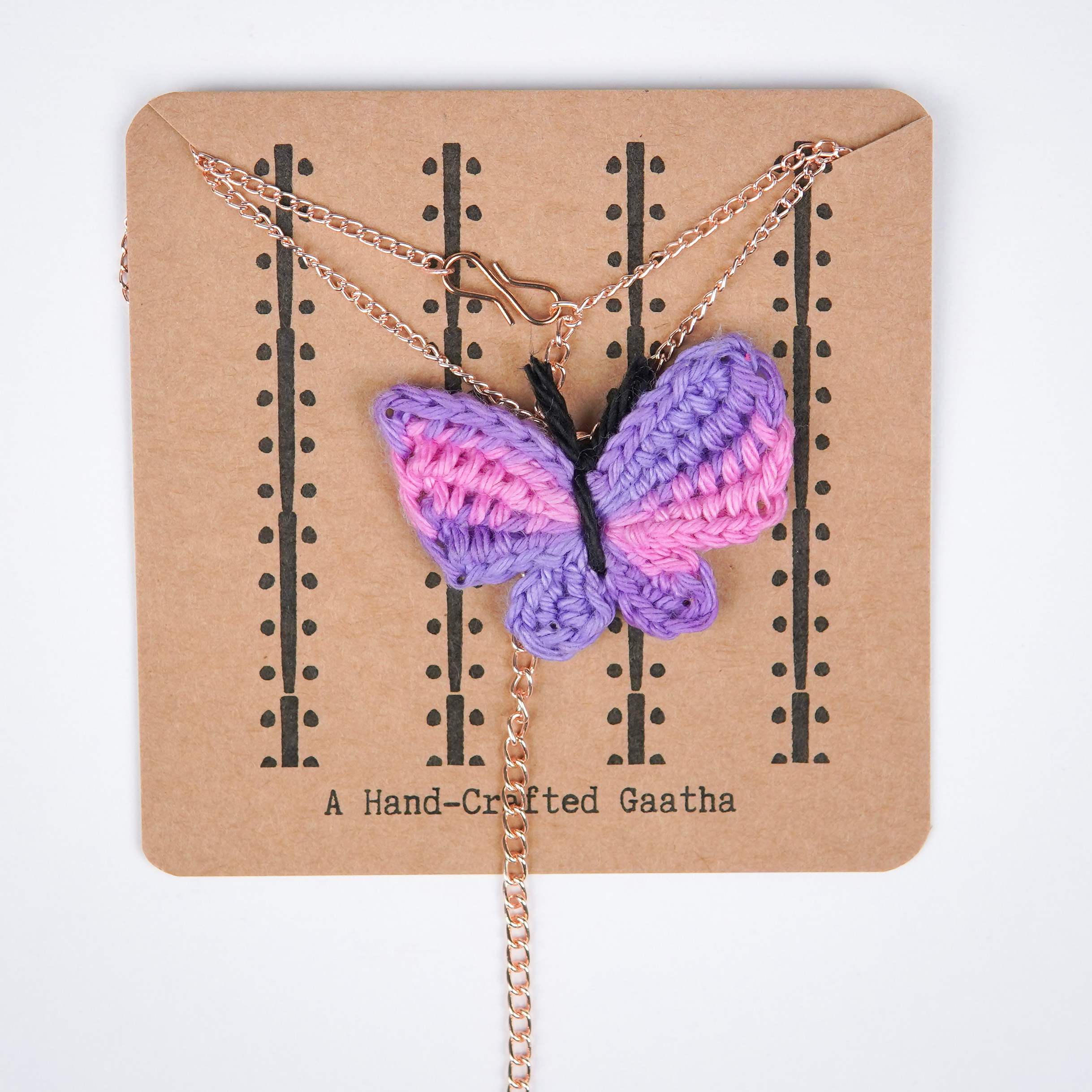 Spring has sprung! Pink & purple crochet titli pendant by A Handcrafted Gaatha.