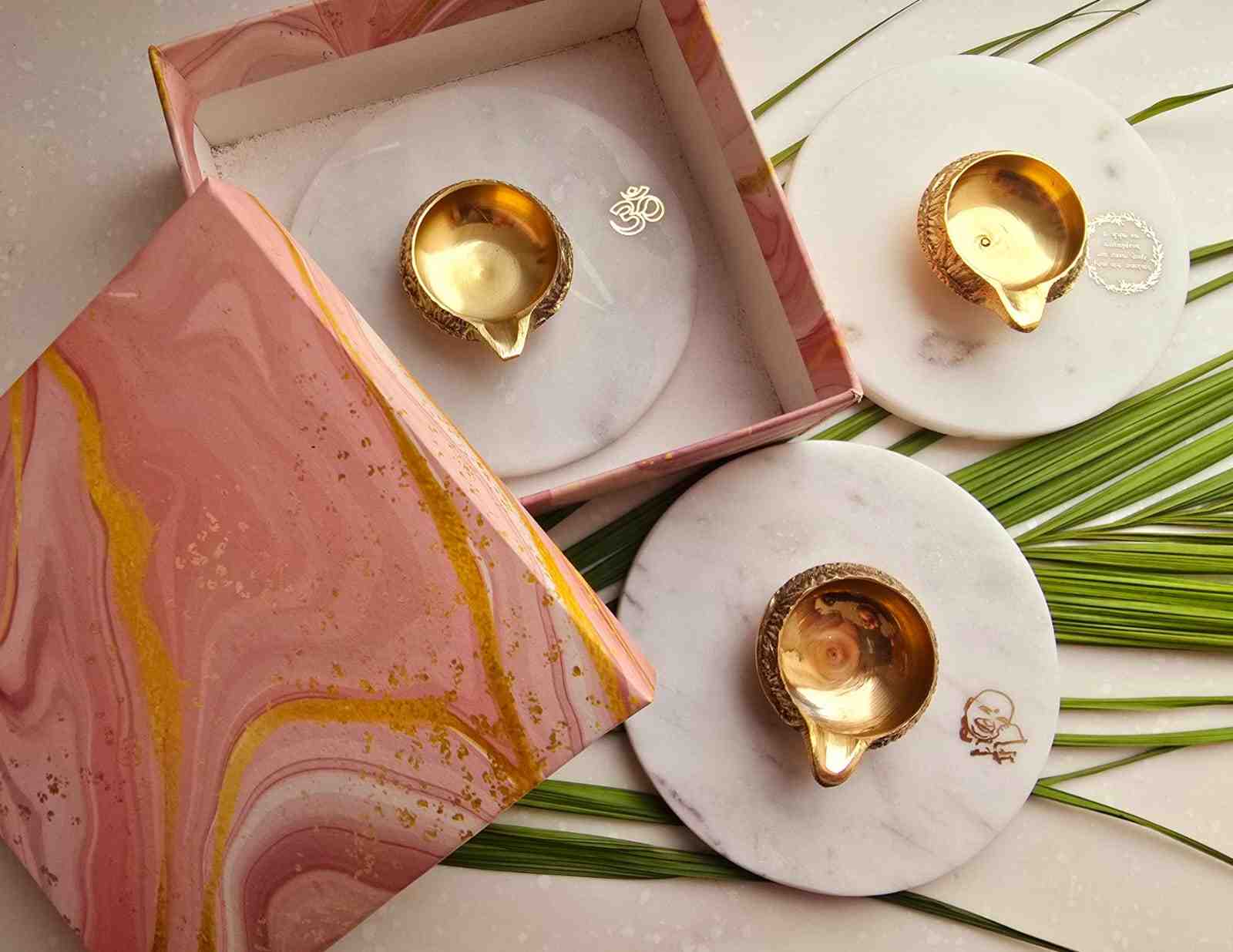 Brass diya in combination with white Indian Marble.