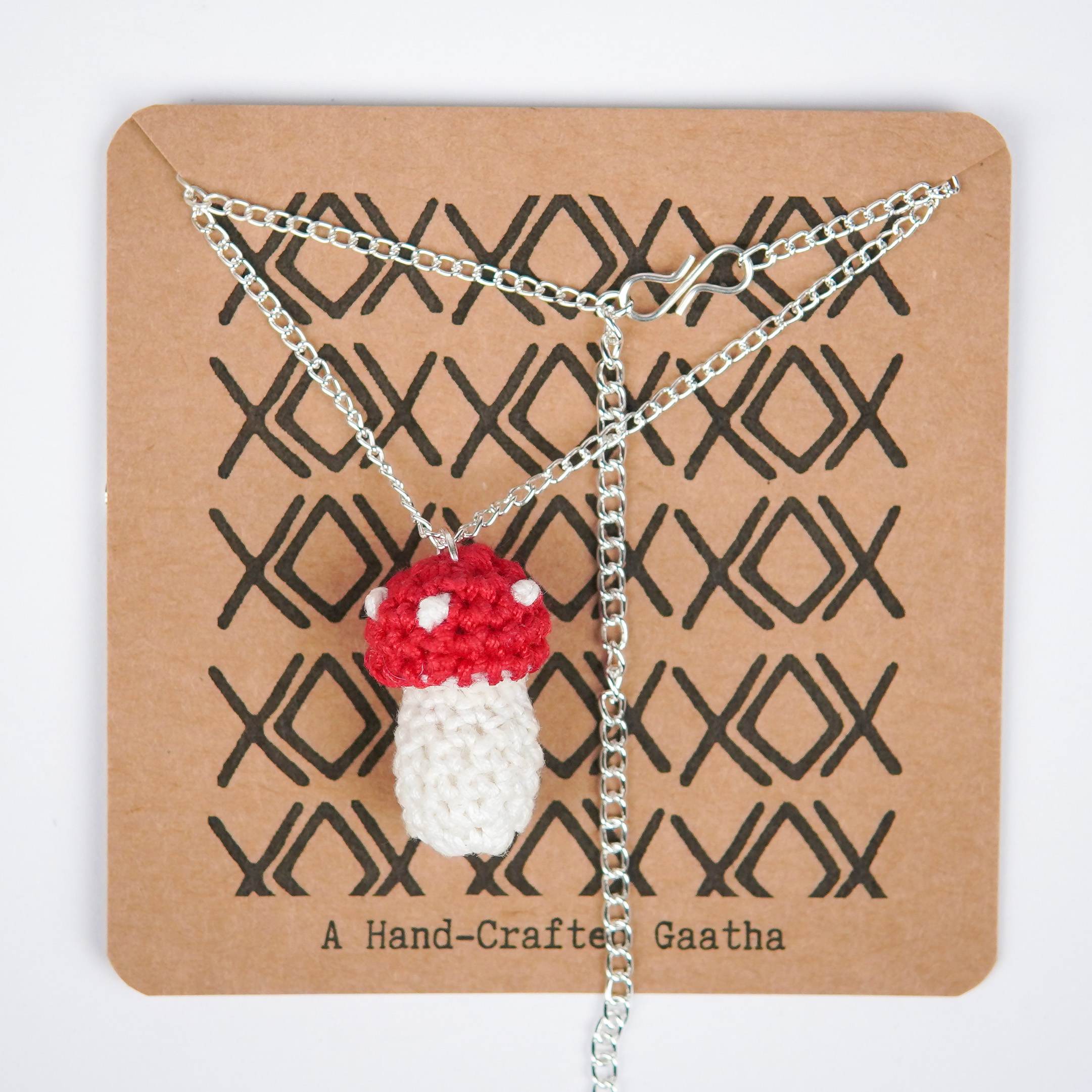 Close-up of AHG's Mushroom Pendant. Delicate details capture the magic of the forest.